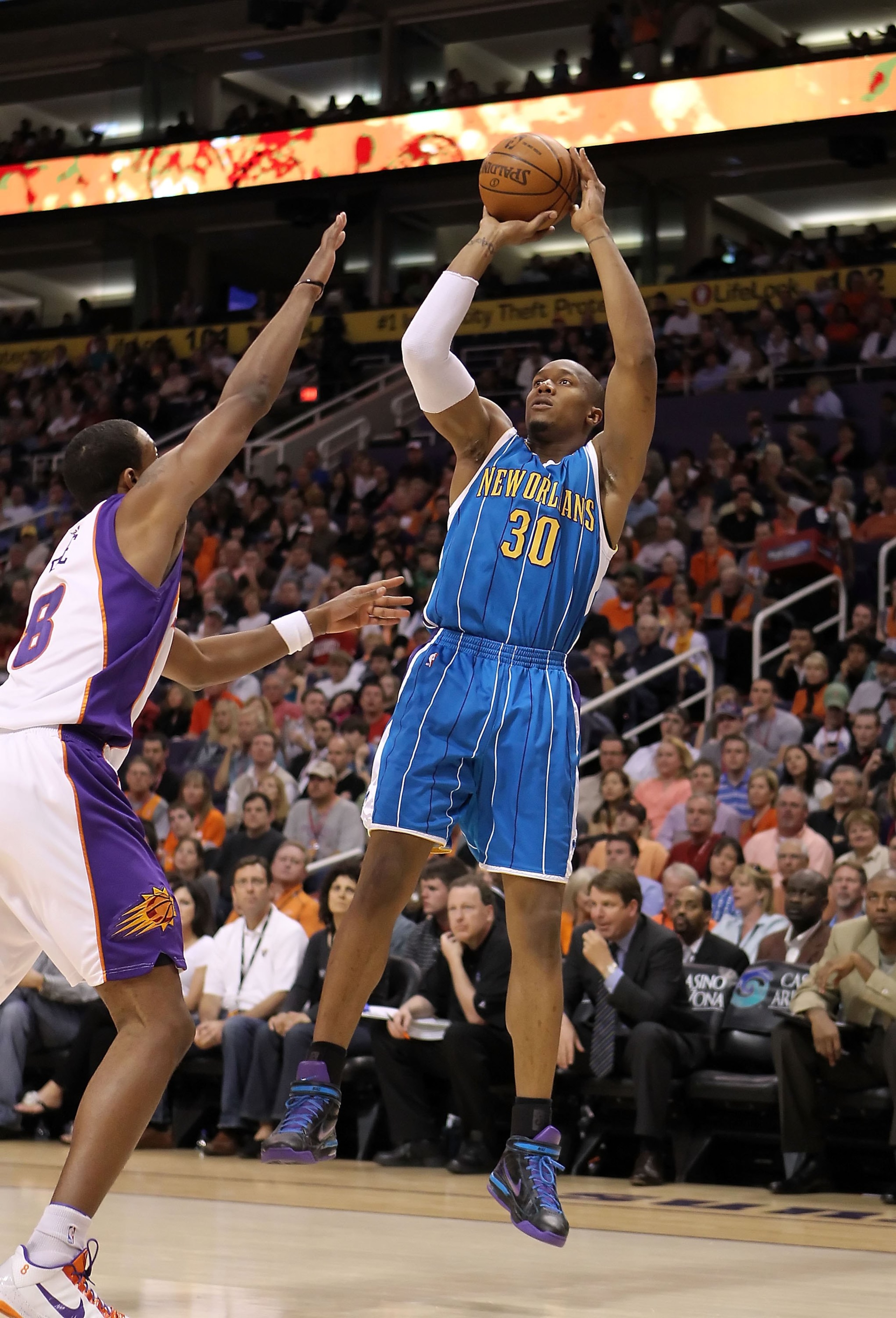 PHOENIX - MARCH 14: David West #30 of the New Orleans Hornets puts up a shot during the NBA game against the Phoenix Suns at US Airways Center on March 14, 2010 in Phoenix, Arizona. The Suns defeated the Hornets 120-106. NOTE TO USER: User expressly ac PHOENIX - MARCH 14: David West #30 of the New Orleans Hornets puts up a shot during the NBA game against the Phoenix Suns at US Airways Center on March 14, 2010 in Phoenix, Arizona. The Suns defeated the Hornets 120-106. NOTE TO USER: User expressly ac