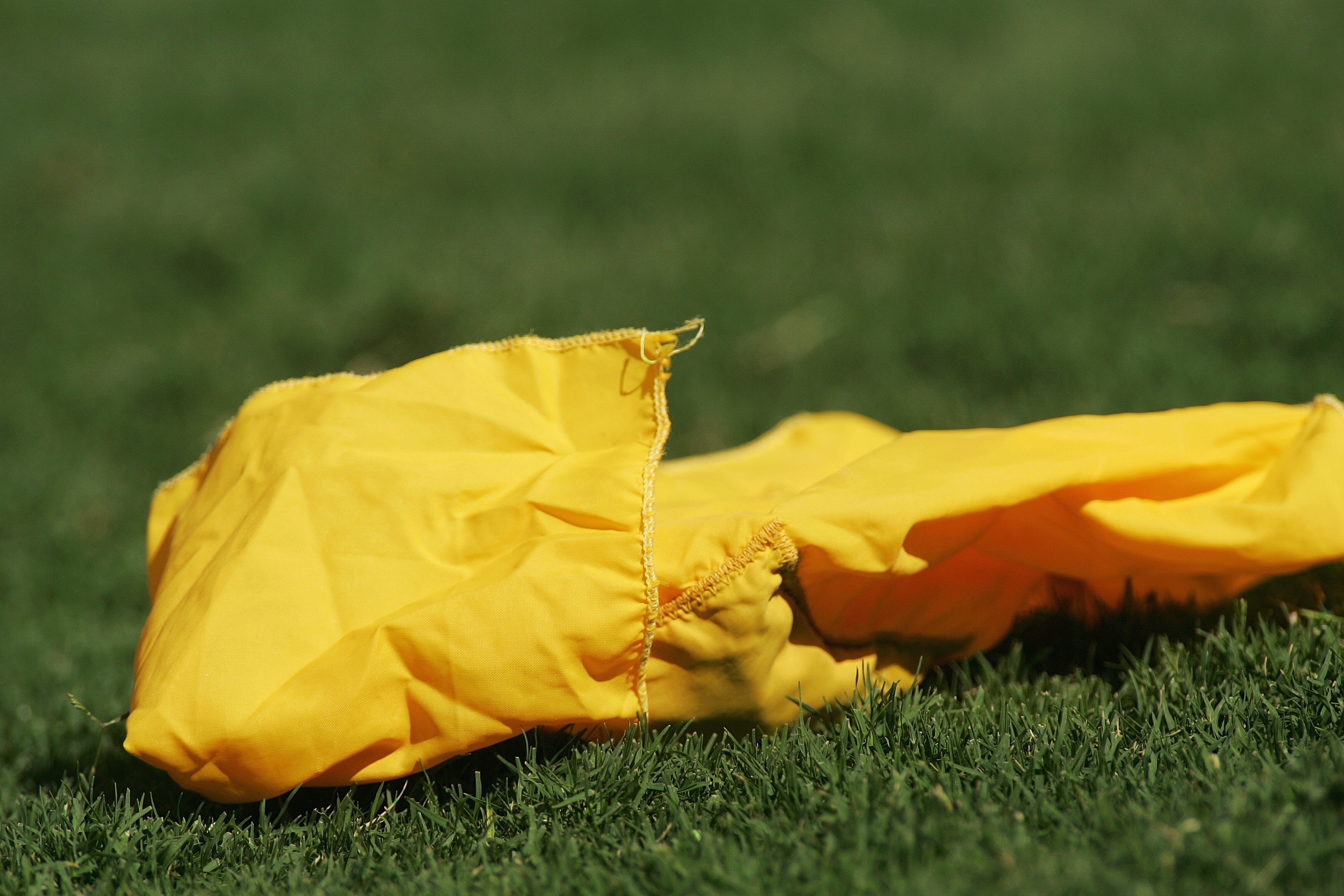 DALLAS - OCTOBER 7:  Detail of the yellow flag thrown by a referee during the Red River Shootout between the Texas Longhorns and the Oklahoma Sooners at the Cotton Bowl on October 7, 2006 in Dallas, Texas. The Longhorns won 28-10. (Photo by Ronald Martine
