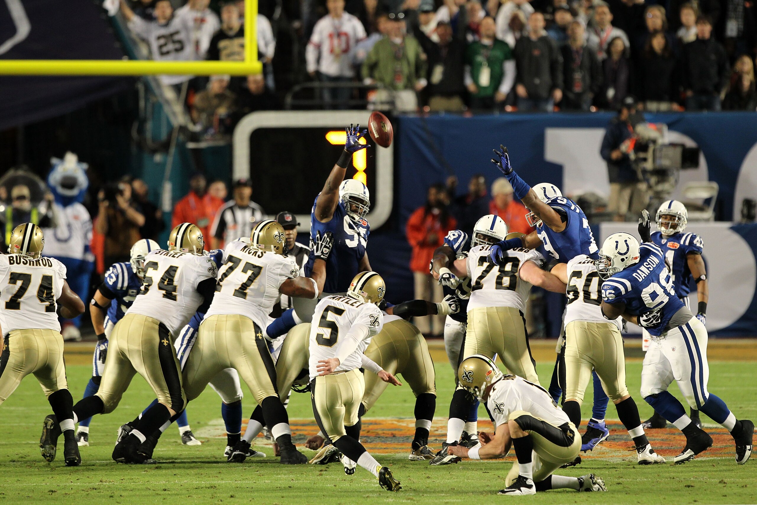 MIAMI GARDENS, FL - FEBRUARY 07: Garrett Hartley #5 of the New Orleans Saints kicks a field goal as Mark Brunell #11 holds against the Indianapolis Colts during Super Bowl XLIV on February 7, 2010 at Sun Life Stadium in Miami Gardens, Florida.  (Photo by