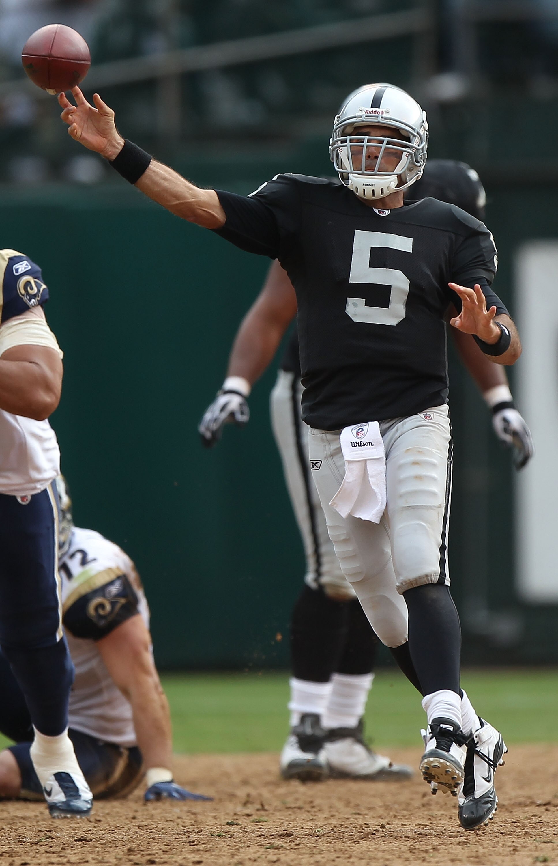 OAKLAND, CA - SEPTEMBER 19:  Bruce Gradkowski #5 of the Oakland Raiders passes against the St. Louis Rams during an NFL game at Oakland-Alameda County Coliseum on September 19, 2010 in Oakland, California.  (Photo by Jed Jacobsohn/Getty Images)