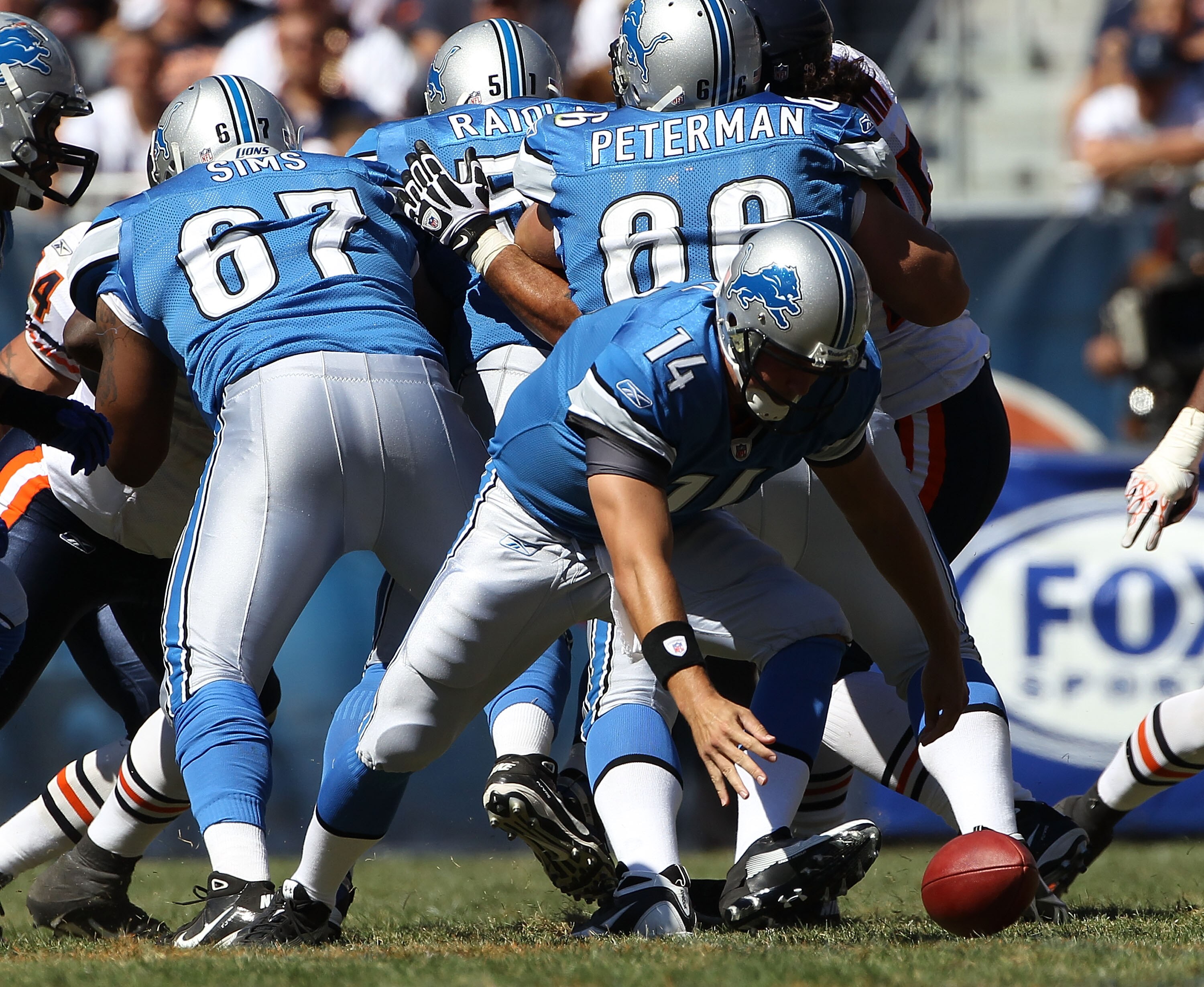CHICAGO - SEPTEMBER 12: Shaun Hill #14 of the Detroit Lions moves to recover a fumbled snap during the NFL season opening game against the Chicago Bears at Soldier Field on September 12, 2010 in Chicago, Illinois. The Bears defeated the Lions 19-14. (Phot