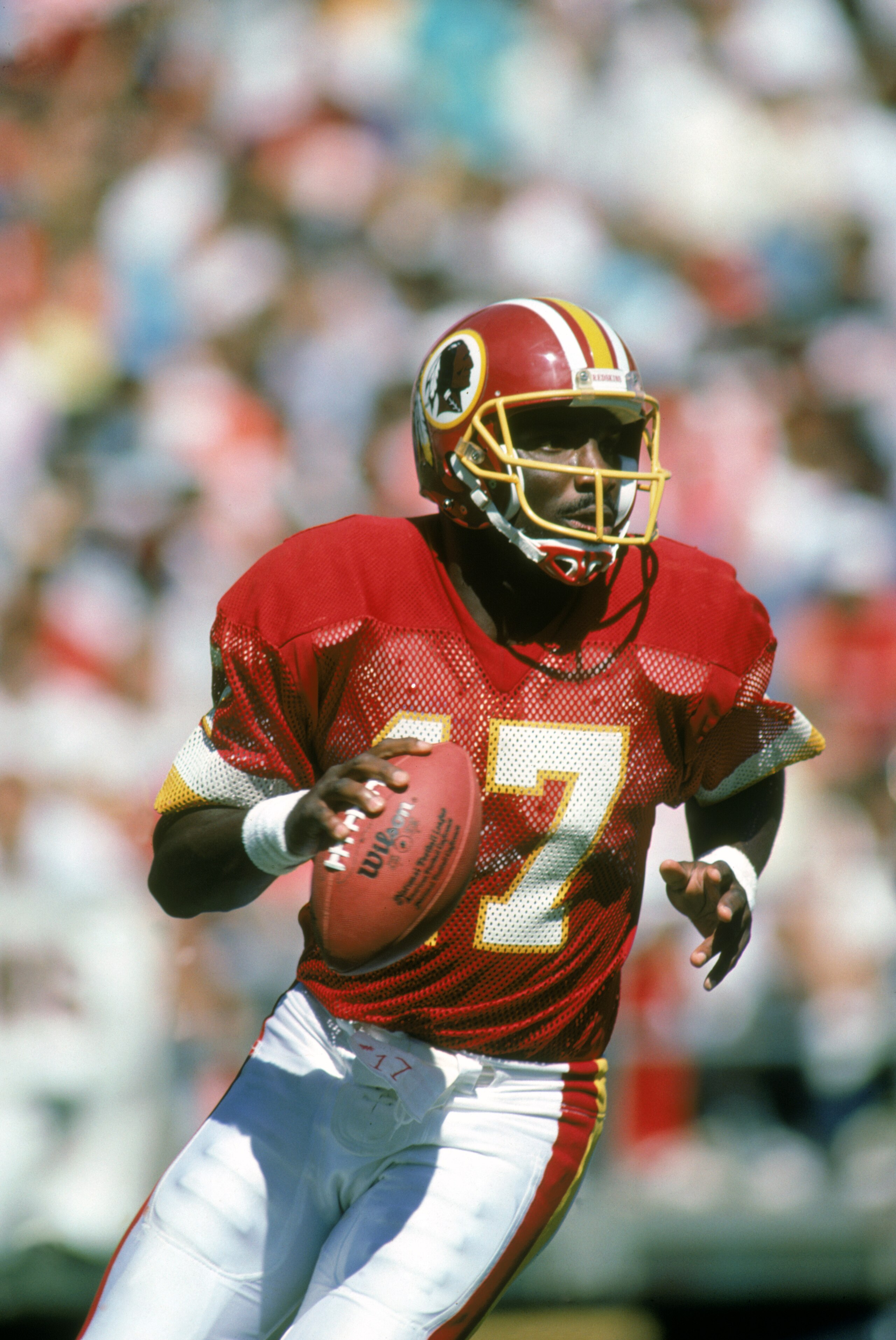 1987: Doug Williams #17 of the Washington Redskins moves back to pass during a 1987 NFL season game. (Photo by: Scott Cunningham/Getty Images) 1987: Doug Williams #17 of the Washington Redskins moves back to pass during a 1987 NFL season game. (Photo by: Scott Cunningham/Getty Images)