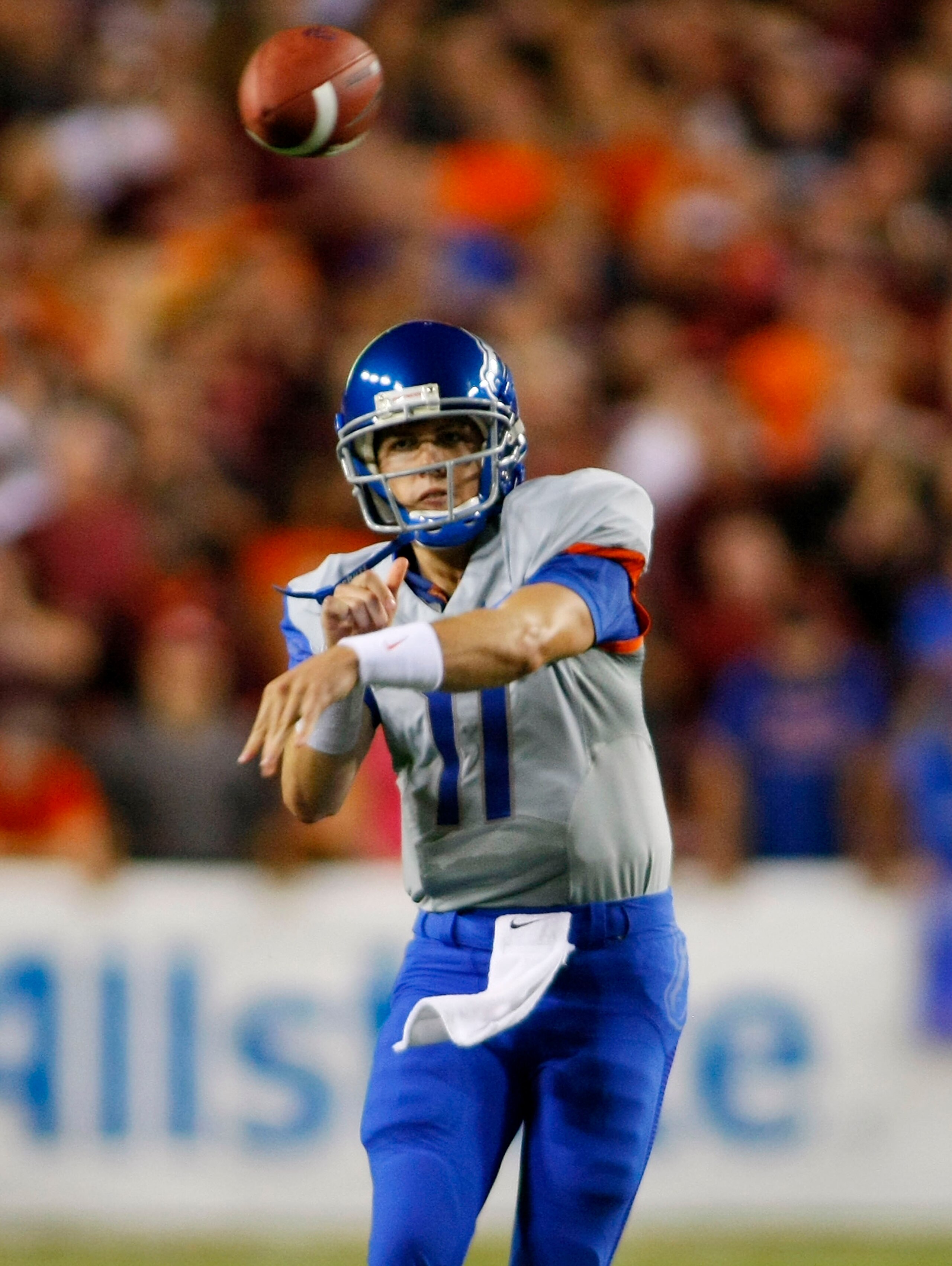 LANDOVER, MD - SEPTEMBER 06:  Quarterback Kellen Moore #11 of the Boise State Broncos passes against the Virginia Tech Hokies at FedExField on September 6, 2010 in Landover, Maryland.  (Photo by Geoff Burke/Getty Images)