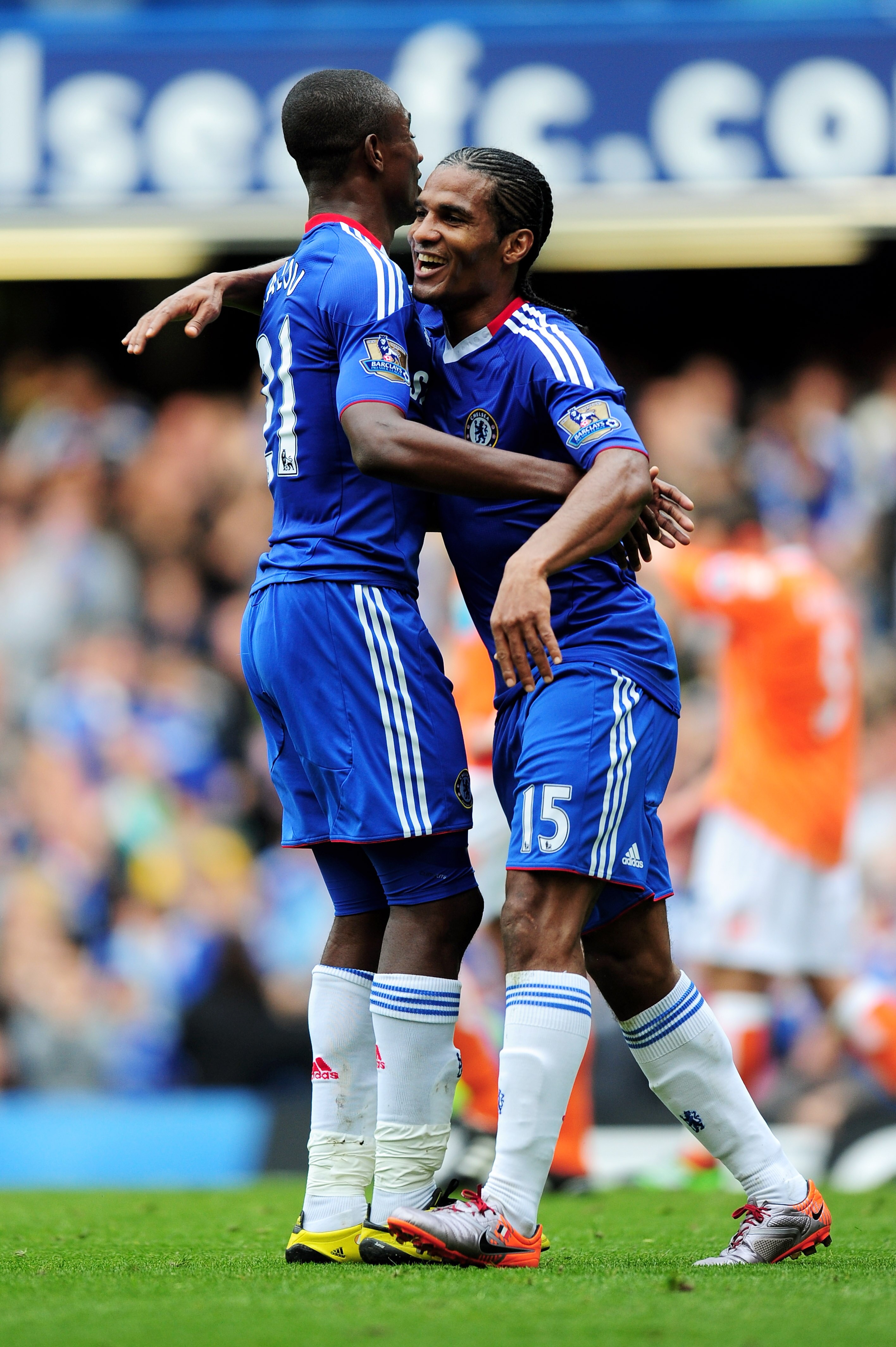 LONDON, ENGLAND - SEPTEMBER 19:  Florent Malouda of Chelsea celebrates with teammate Salomon Kalou (L) after scoring his team's fourth goal during the Barclays Premier League match between Chelsea and Blackpool at Stamford Bridge on September 19, 2010 in