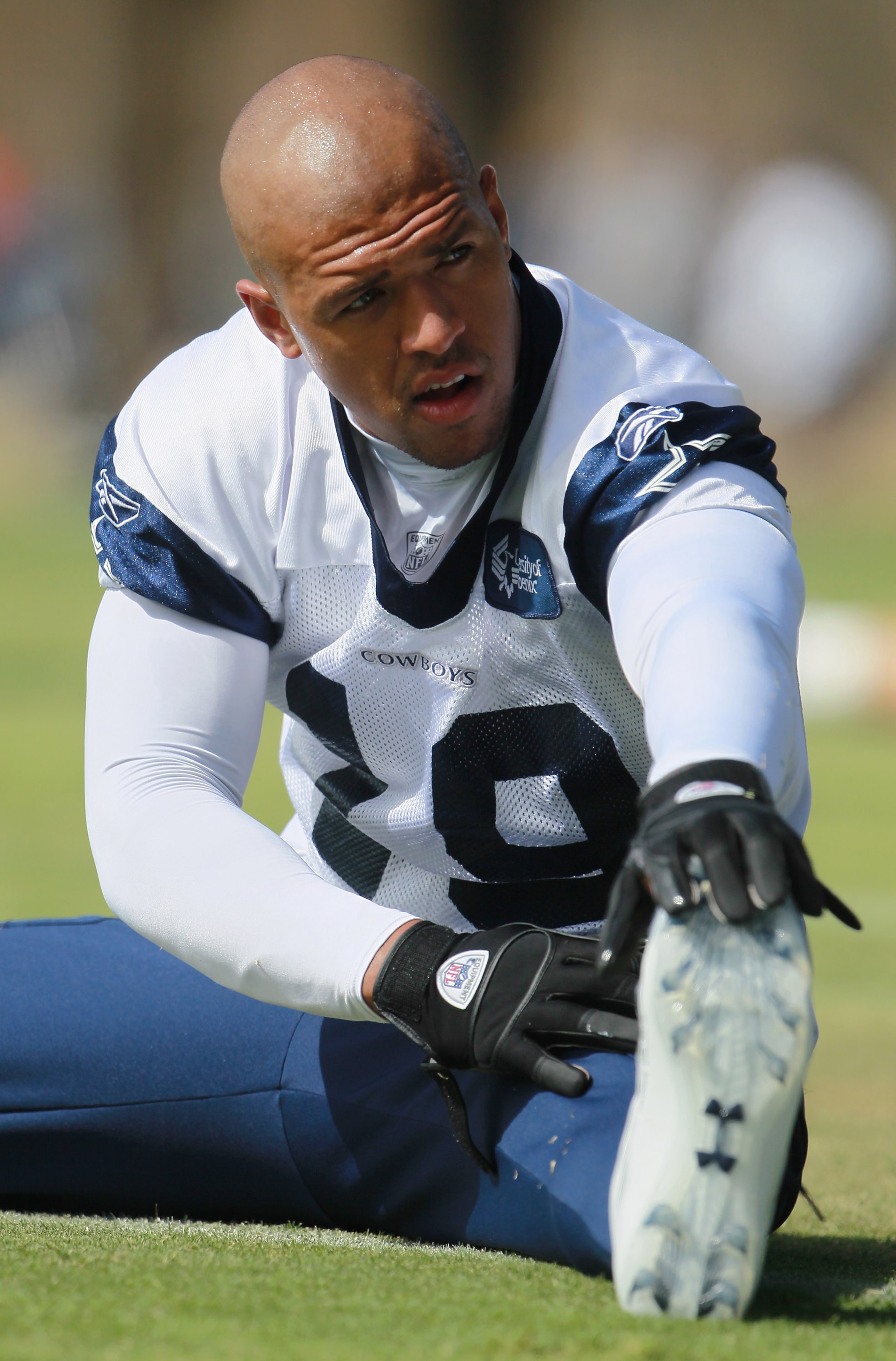 OXNARD, CA - AUGUST 14:  Wide receiver Miles Austin #19 stretches during Dallas Cowboys Training Camp at the Marriott Residence Inn Oxnard River Ridge on August 14, 2010 in Oxnard, California.  (Photo by Jeff Gross/Getty Images)