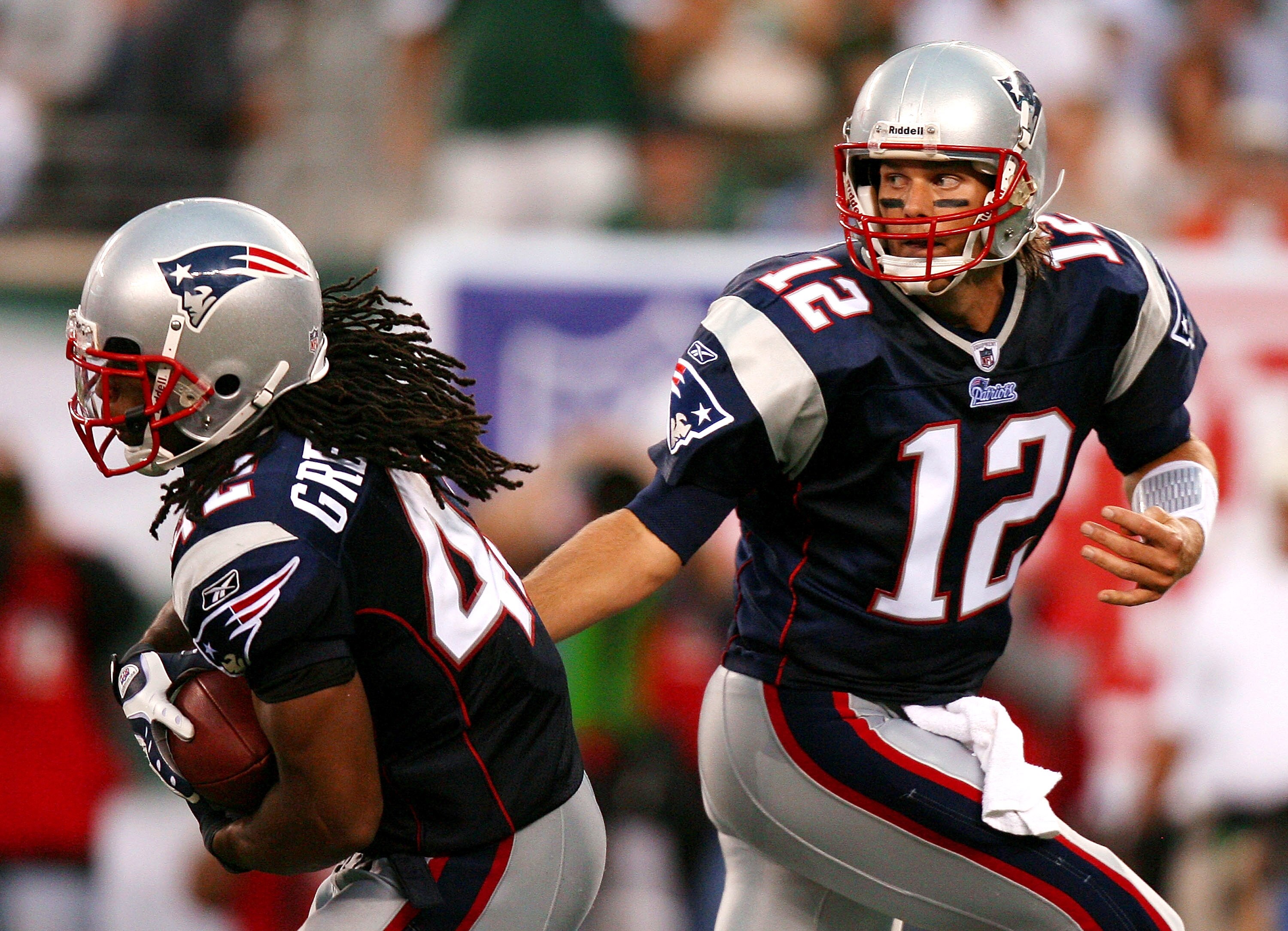 EAST RUTHERFORD, NJ - SEPTEMBER 19: Tom Brady #12 of the New England Patriots hands the ball off to BenJarvus Green-Ellis #42 during a game against the New York Jets at the New Meadowlands Stadium on September 19, 2010 in East Rutherford, New Jersey. The EAST RUTHERFORD, NJ - SEPTEMBER 19: Tom Brady #12 of the New England Patriots hands the ball off to BenJarvus Green-Ellis #42 during a game against the New York Jets at the New Meadowlands Stadium on September 19, 2010 in East Rutherford, New Jersey. The