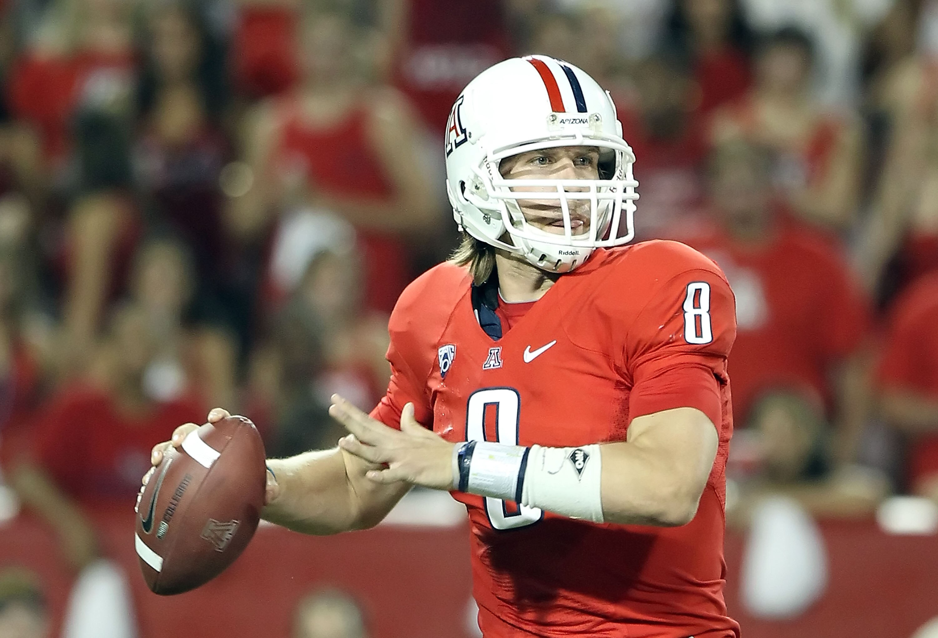 TUCSON, AZ - SEPTEMBER 18:  Quarterback Nick Foles #8 of the Arizona Wildcats drops back to pass during the college football game against the Iowa Hawkeyes at Arizona Stadium on September 18, 2010 in Tucson, Arizona. The Wildcats defeated the Hawkeyes 34-