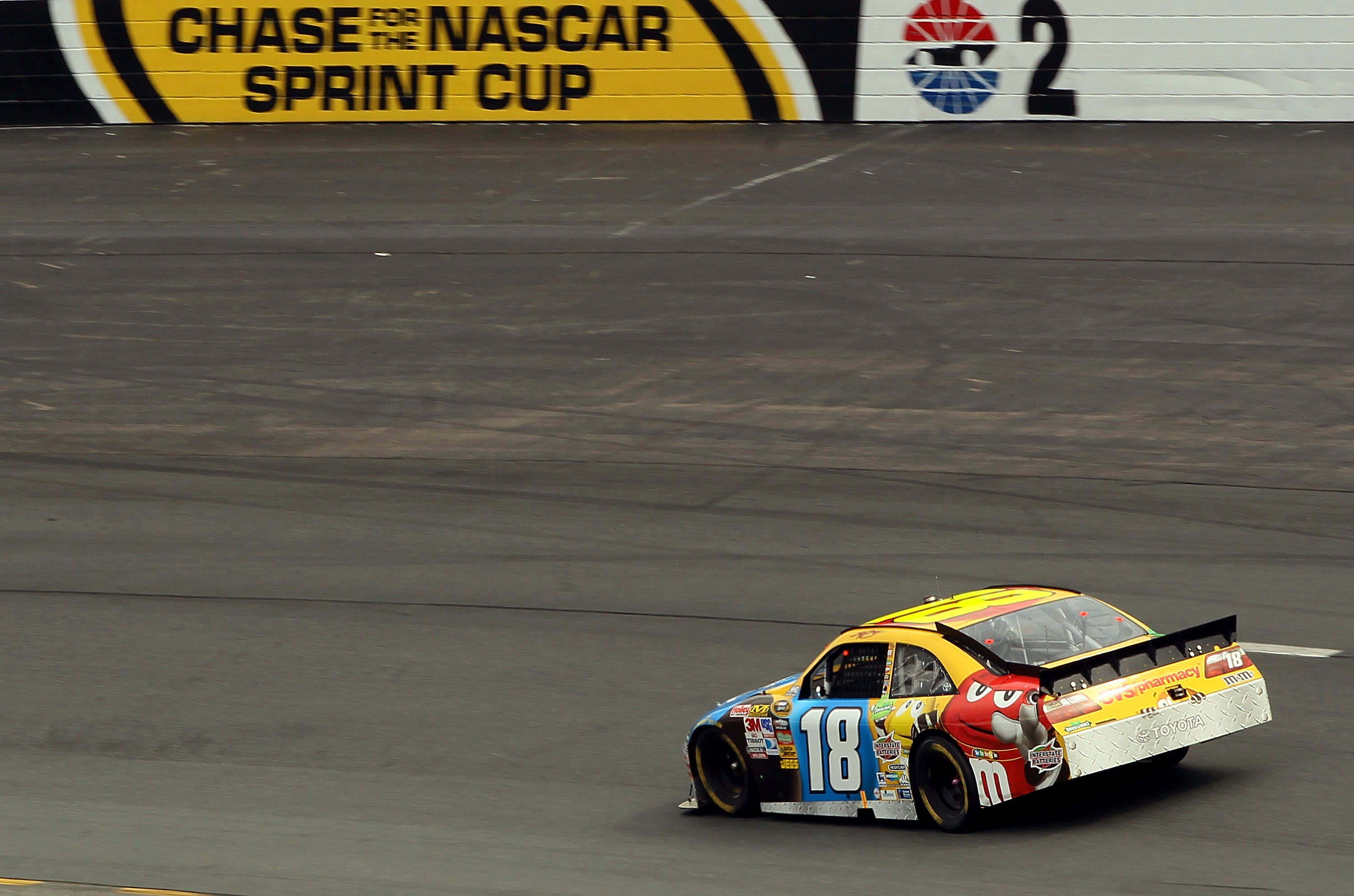 LOUDON, NH - SEPTEMBER 19:  Kyle Busch, driver of the #18 M&M's Toyota, races during the NASCAR Sprint Cup Series Sylvania 300 at New Hampshire Motor Speedway on September 19, 2010 in Loudon, New Hampshire.  (Photo by Elsa/Getty Images)