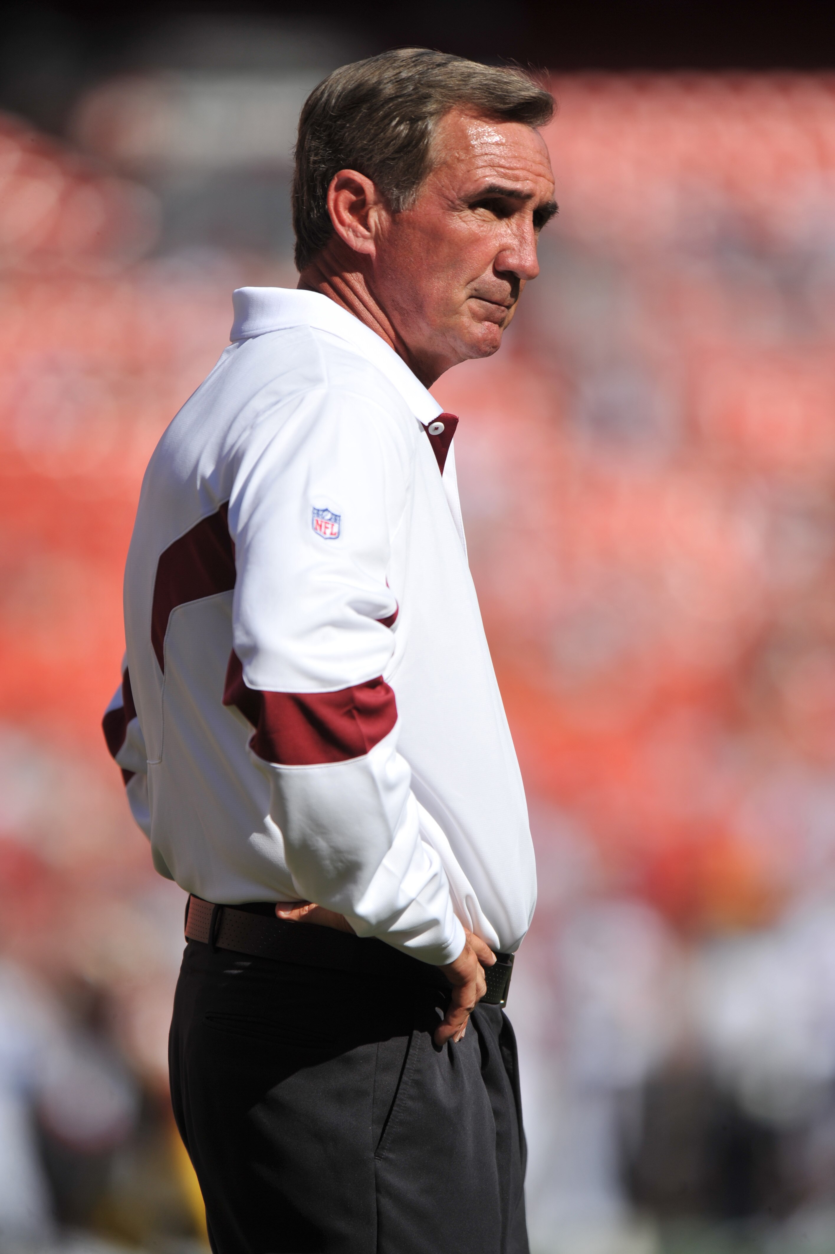 LANDOVER - SEPTEMBER 19:  Head coach Mike Shanahan of the Washington Redskins watches his team warm up before the game against the Houston Texans at FedExField on September 19, 2010 in Landover, Maryland. The Texans defeated the Redskins 30-27 in overtime