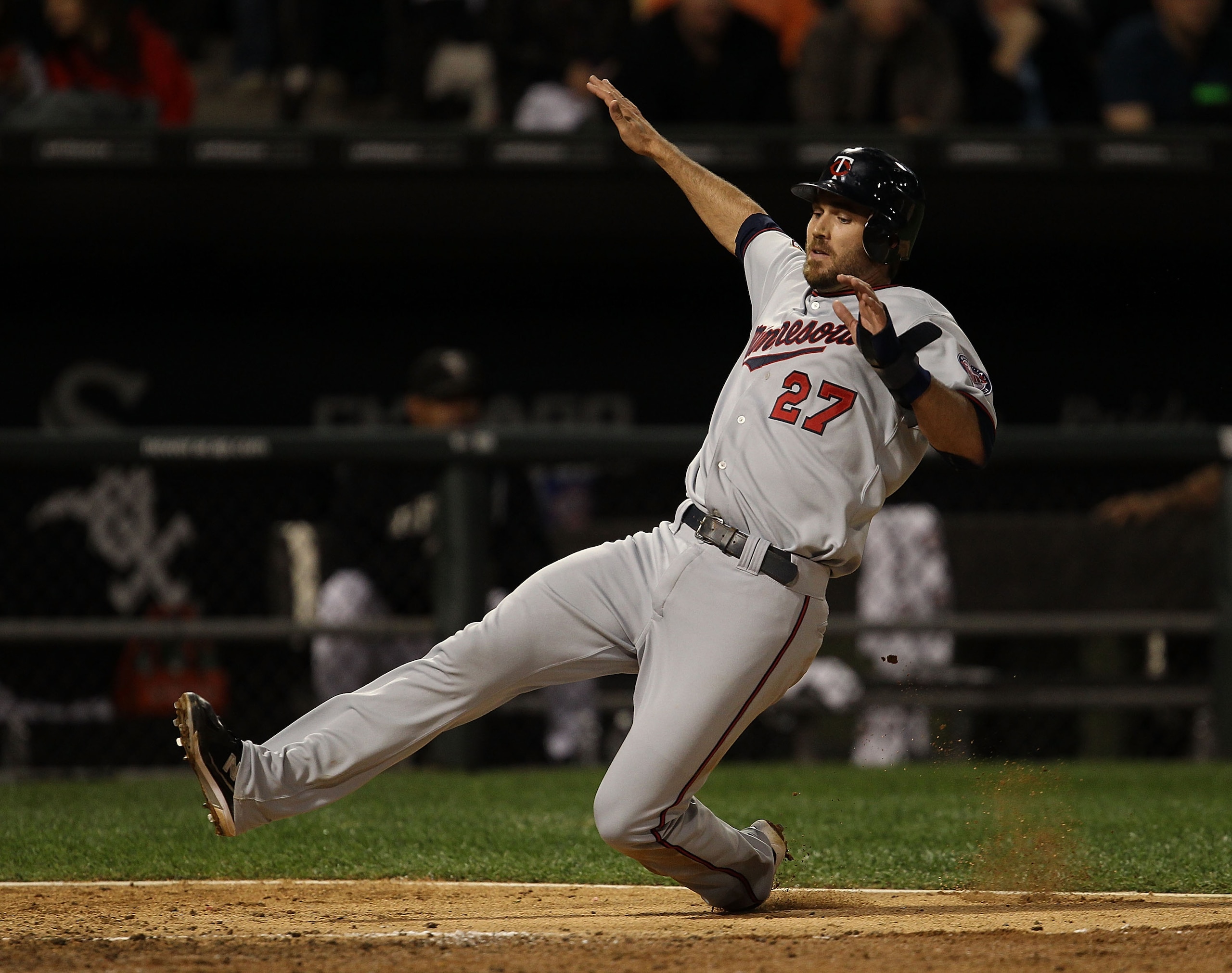 CHICAGO - SEPTEMBER 14: J.J. Hardy #27 of the Minnesota Twins slides into the plate to score a run against the Chicago White Sox at U.S. Cellular Field on September 14, 2010 in Chicago, Illinois. (Photo by Jonathan Daniel/Getty Images) CHICAGO - SEPTEMBER 14: J.J. Hardy #27 of the Minnesota Twins slides into the plate to score a run against the Chicago White Sox at U.S. Cellular Field on September 14, 2010 in Chicago, Illinois. (Photo by Jonathan Daniel/Getty Images)