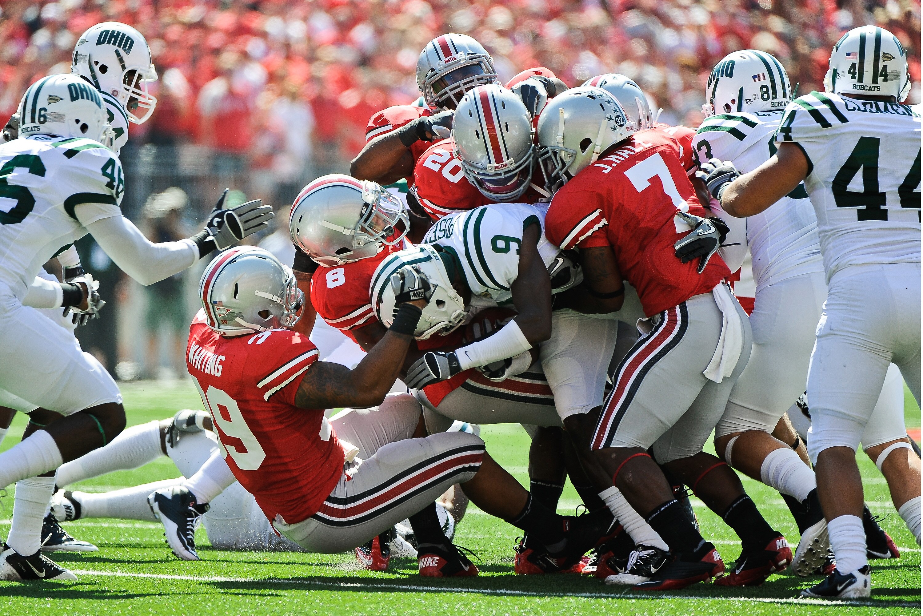 COLUMBUS, OH - SEPTEMBER 18:  The Ohio State Buckeyes kickoff team gang tackles Julian Posey #9 of the Ohio Bobcats at Ohio Stadium on September 18, 2010 in Columbus, Ohio.  (Photo by Jamie Sabau/Getty Images)