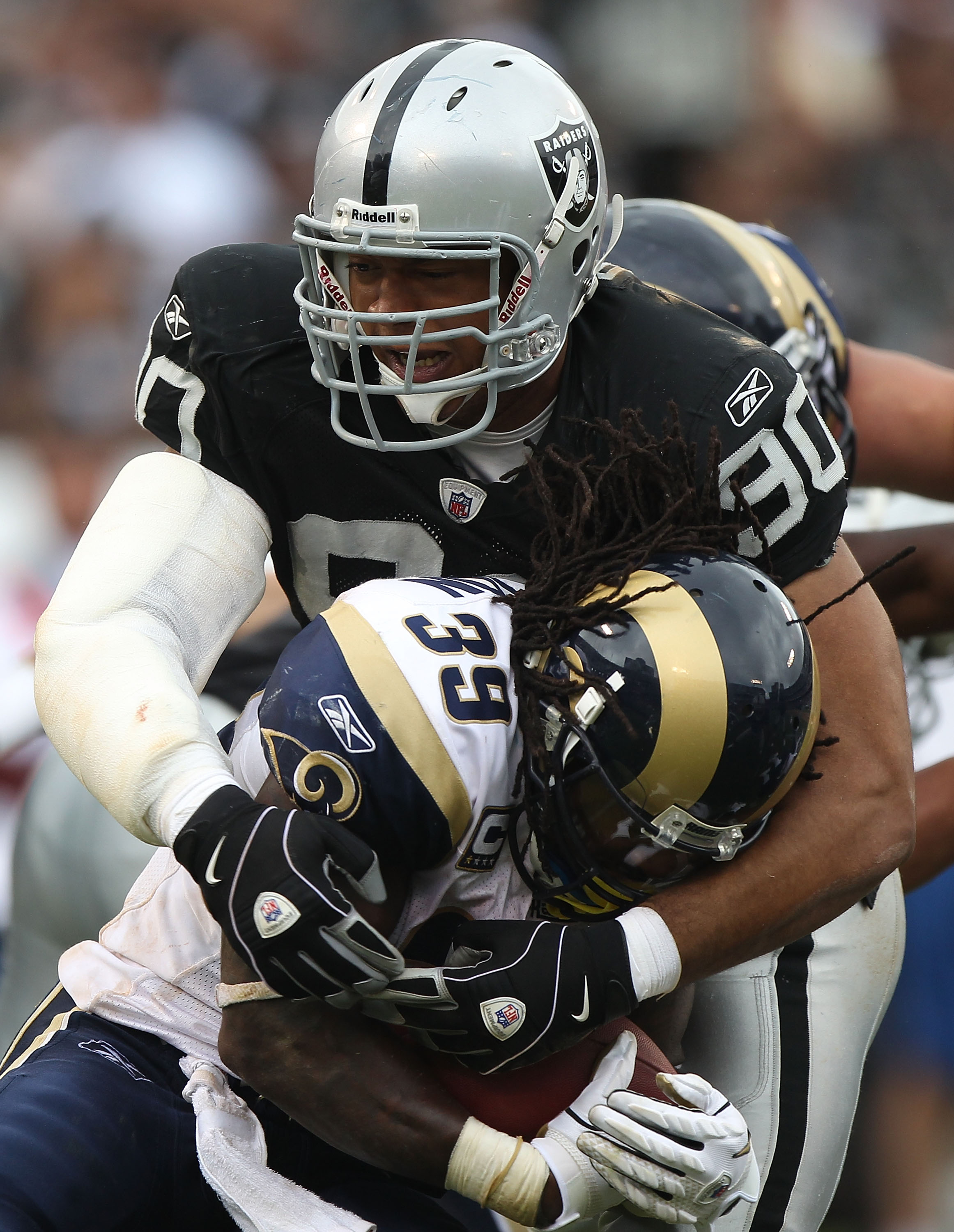 OAKLAND, CA - SEPTEMBER 19:  Steven Jackson #39 of the St. Louis Rams is tackled by Desmond Bryant #90 of the Oakland Raiders during an NFL game at Oakland-Alameda County Coliseum on September 19, 2010 in Oakland, California.  (Photo by Jed Jacobsohn/Gett