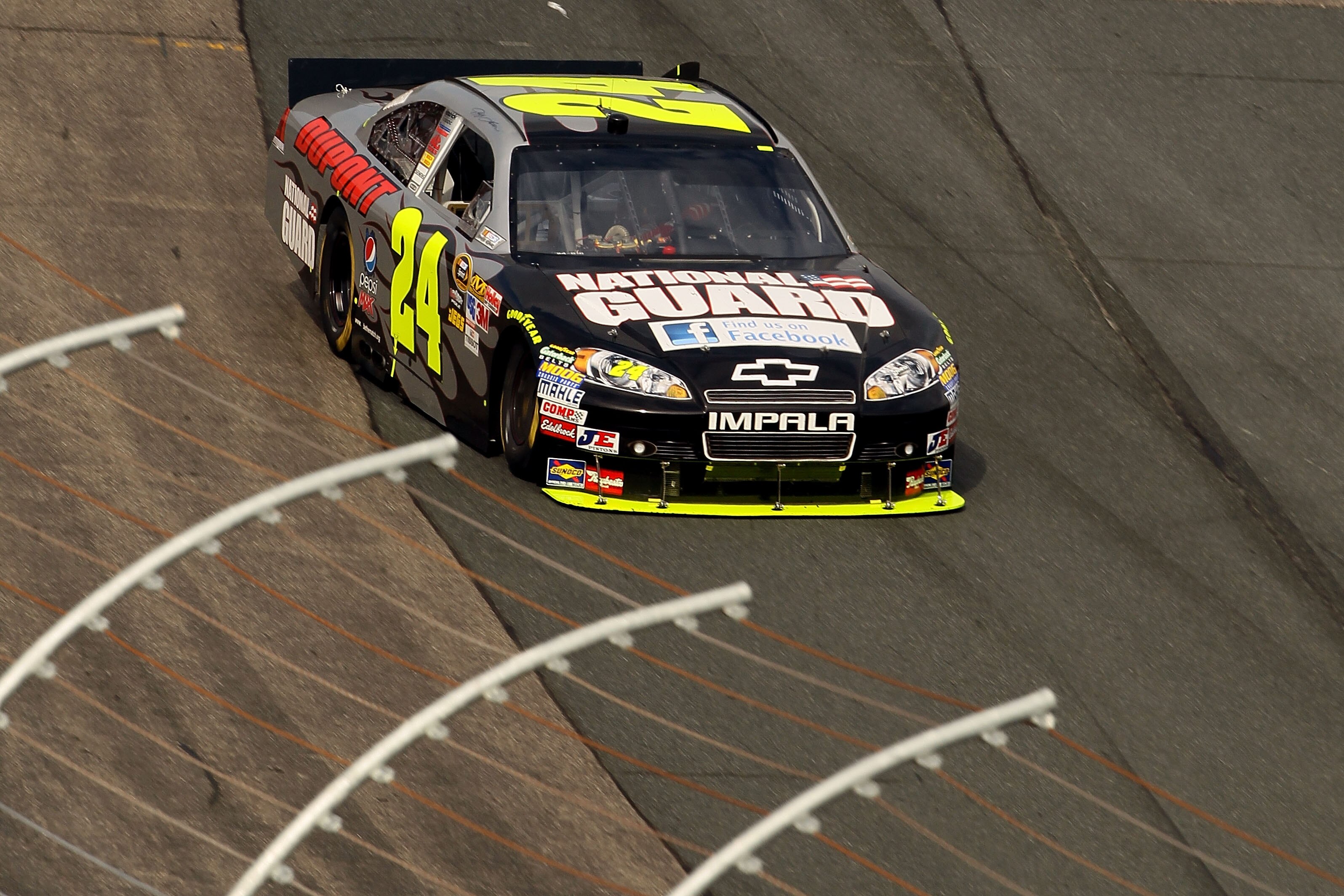 LOUDON, NH - SEPTEMBER 19:  Jeff Gordon, driver of the #24 DuPont / Facebook National Guard Chevrolet, races during the NASCAR Sprint Cup Series Sylvania 300 at New Hampshire Motor Speedway on September 19, 2010 in Loudon, New Hampshire.  (Photo by Elsa/G