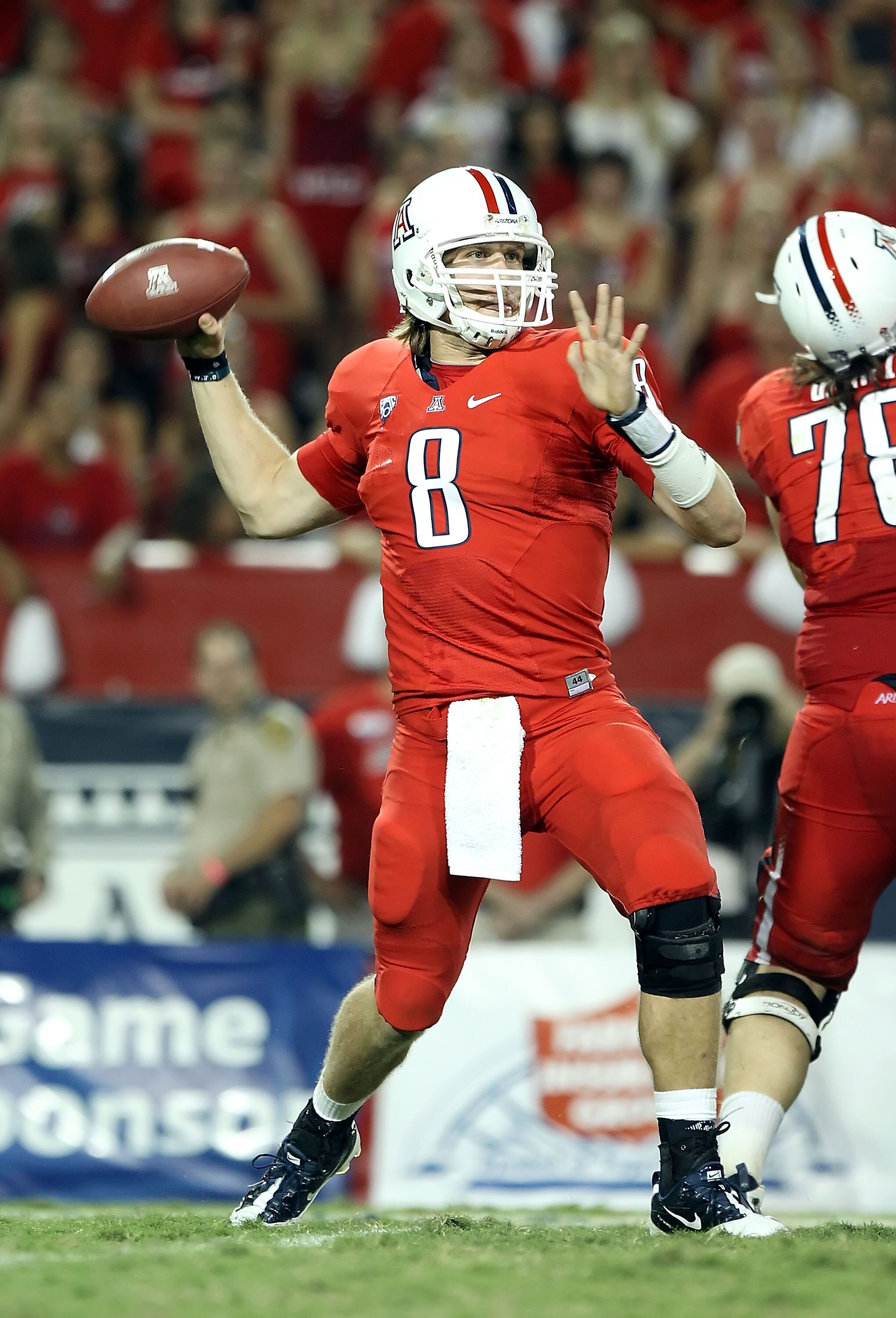 TUCSON, AZ - SEPTEMBER 18:  Quarterback Nick Foles #8 of the Arizona Wildcats throws a pass during the college football game against the Iowa Hawkeyes at Arizona Stadium on September 18, 2010 in Tucson, Arizona. The Wildcats defeated the Hawkeyes 34-27.