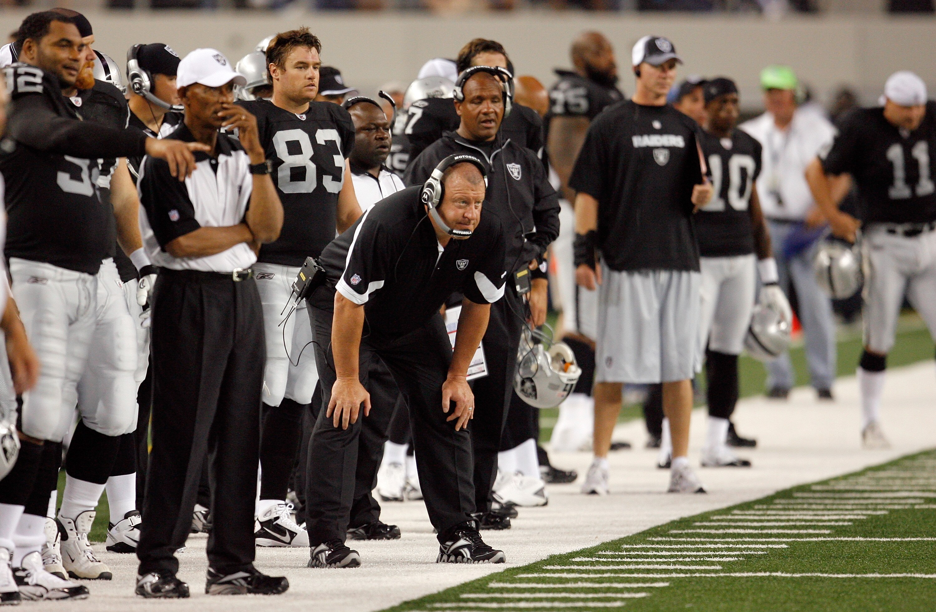 ARLINGTON, TX - AUGUST 12: Tom Cable, head coach of the Oakland Raiders, leads his team in the preseason game against the Dallas Cowboys at the Dallas Cowboys Stadium on August 12, 2010 in Arlington, Texas. (Photo by Tom Pennington/Getty Images)