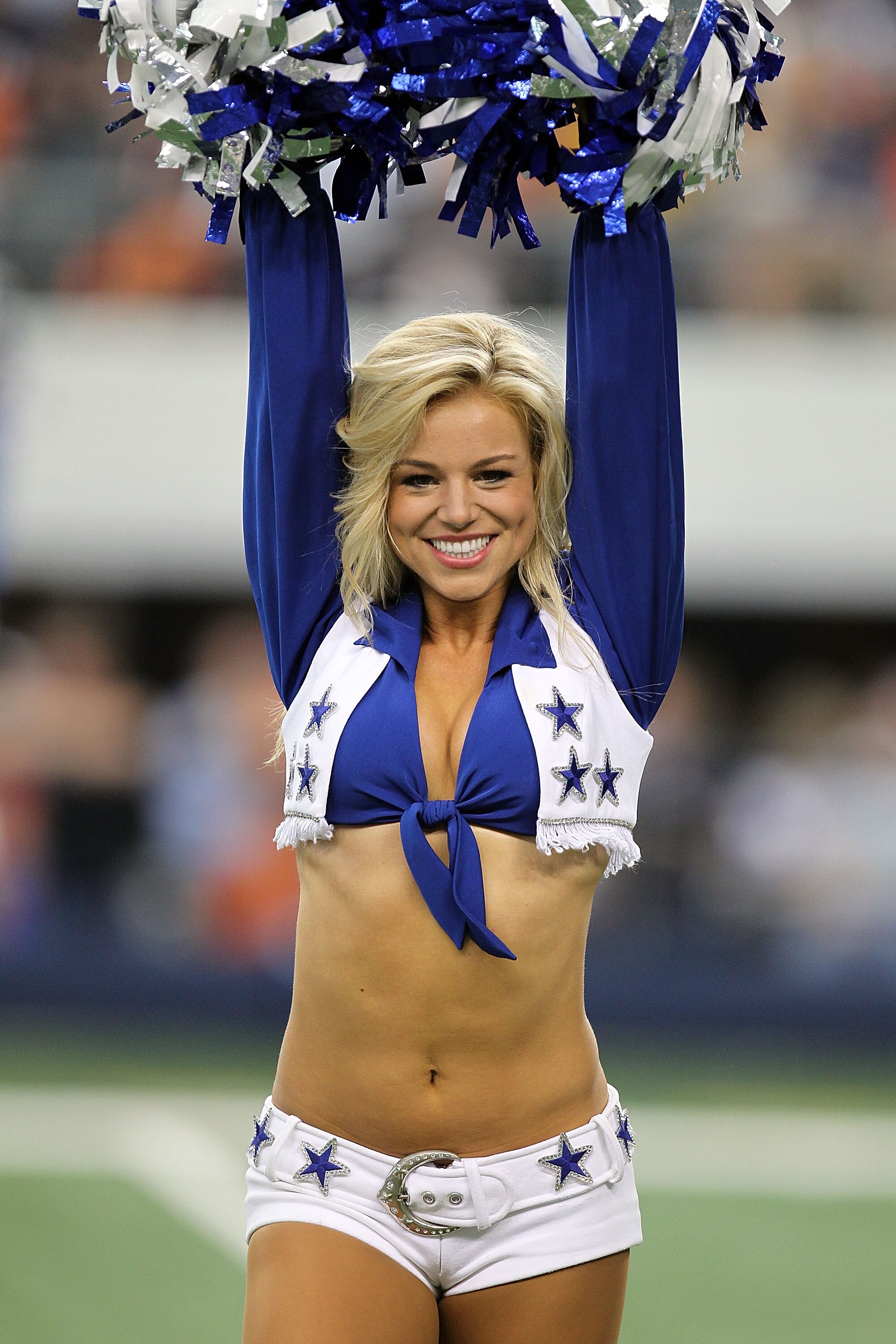 ARLINGTON, TX - SEPTEMBER 19:  A Dallas Cowboys Cheerleader performs during a game against the Chicago Bears at Cowboys Stadium on September 19, 2010 in Arlington, Texas.  (Photo by Ronald Martinez/Getty Images)