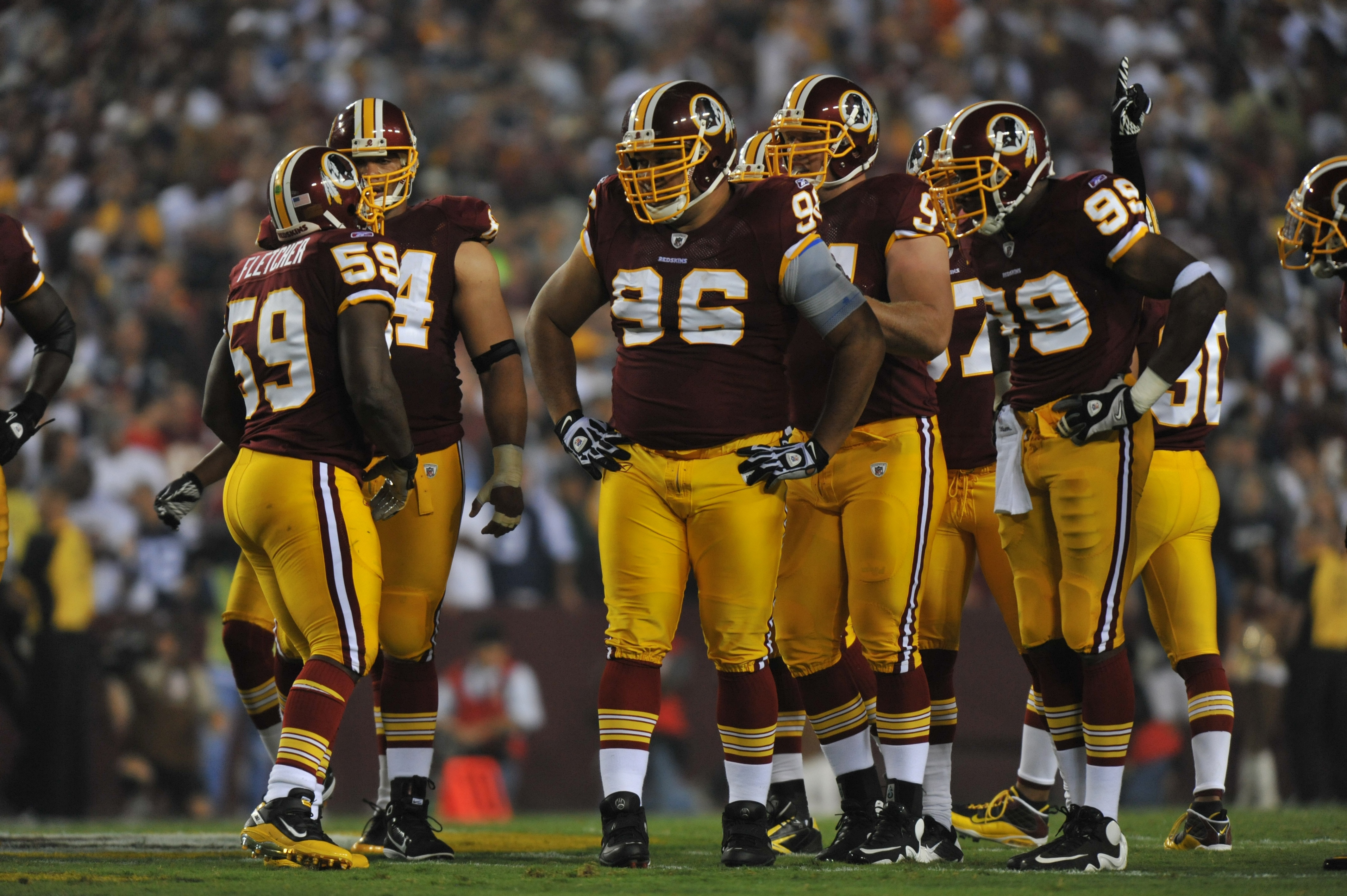 LANDOVER - SEPTEMBER 12:  Maake Kemoeatu #96 of the Washington Redskins walks to the line of scrimmage with the defensive line during the NFL season opener against the Dallas Cowboys at FedExField on September 12, 2010 in Landover, Maryland. The Redskins