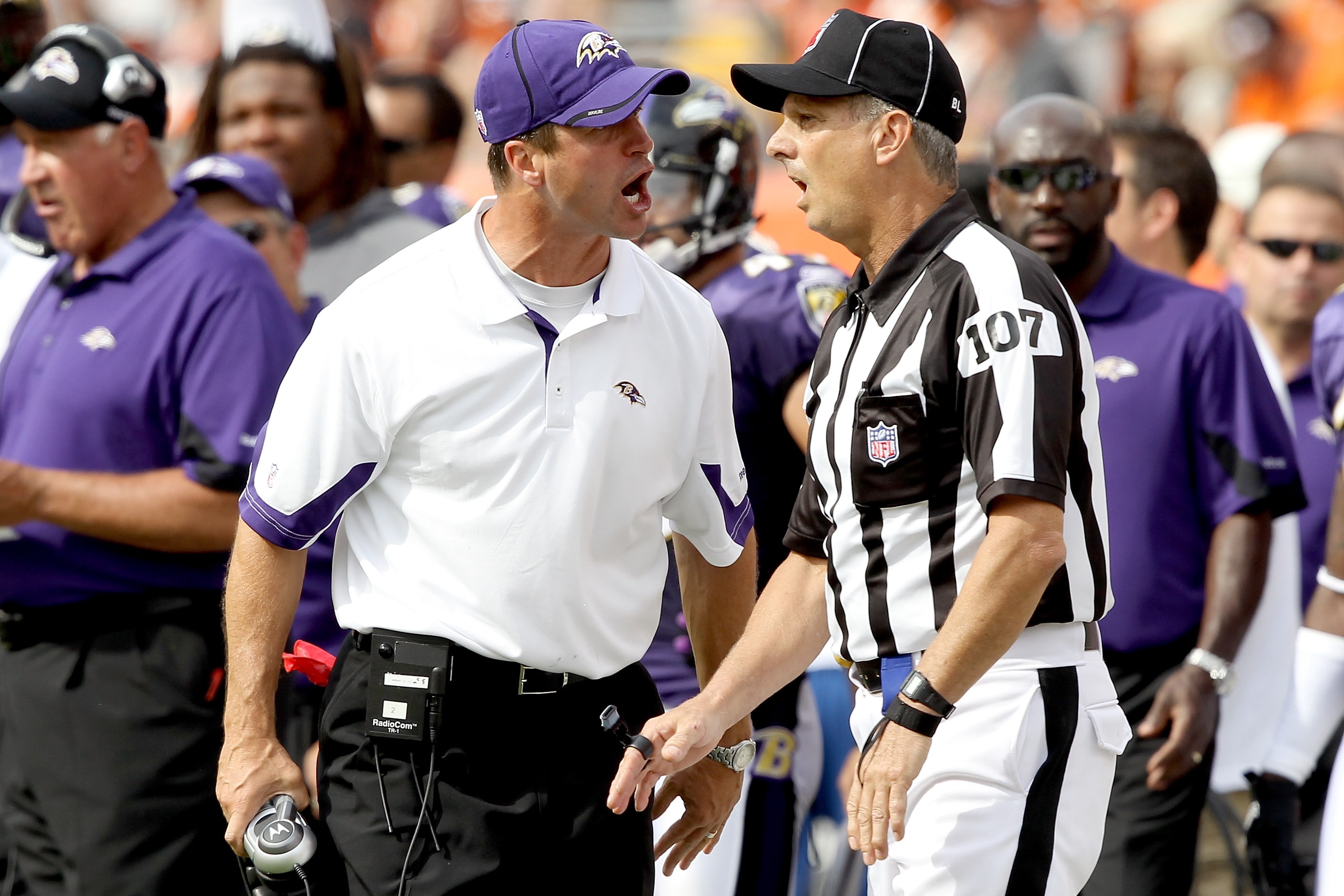 CINCINNATI - SEPTEMBER 19: Head coach John Harbaugh of the Baltimore Ravens argues a call with line judge Ron Marinucci #107 while playing the Cincinnati Bengals at Paul Brown Stadium on September 19, 2010 in Cincinnati, Ohio.  (Photo by Matthew Stockman/