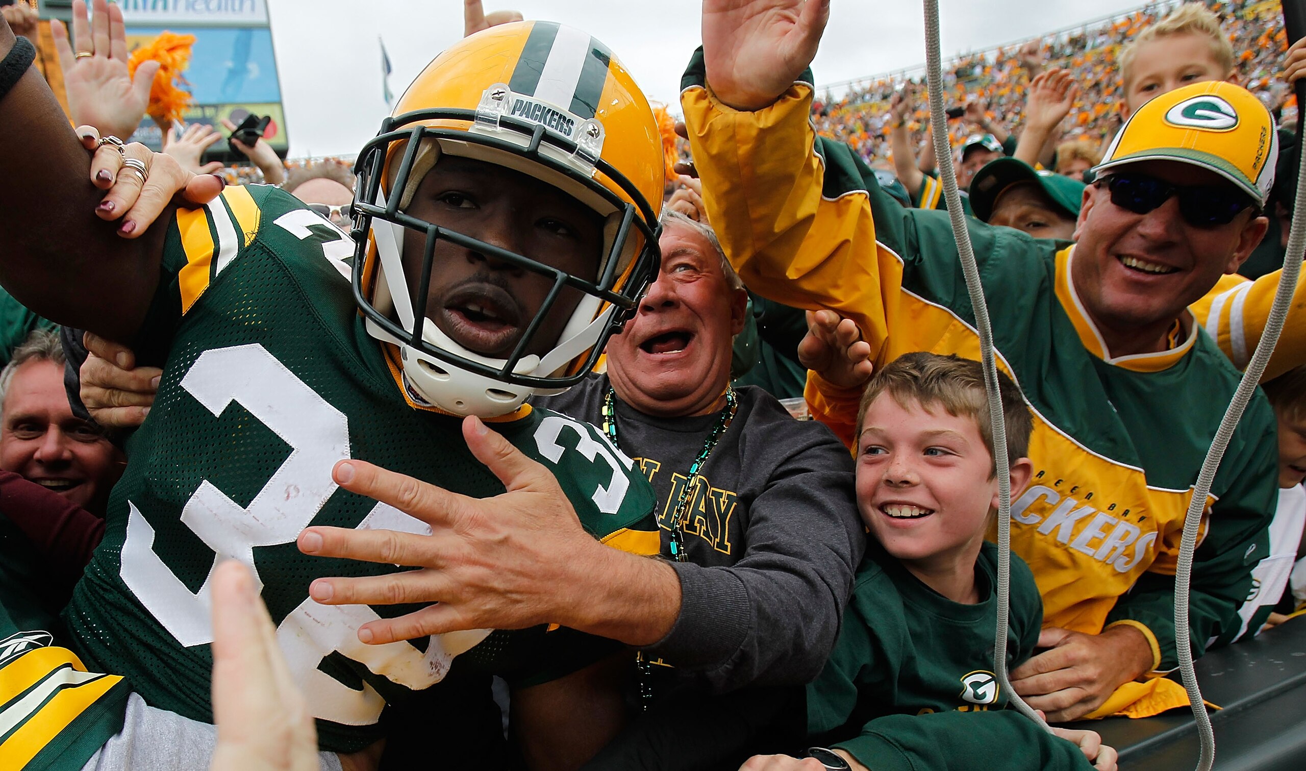 GREEN BAY, WI - SEPTEMBER 19: Brandon Jackson #32 of the Green Bay Packers celebrates a touchdown with a 'Lambeau Leap' into the stands against of the Buffalo Bills at Lambeau Field on September 19, 2010 in Green Bay, Wisconsin. (Photo by Jonathan Daniel/ GREEN BAY, WI - SEPTEMBER 19: Brandon Jackson #32 of the Green Bay Packers celebrates a touchdown with a 'Lambeau Leap' into the stands against of the Buffalo Bills at Lambeau Field on September 19, 2010 in Green Bay, Wisconsin. (Photo by Jonathan Daniel/