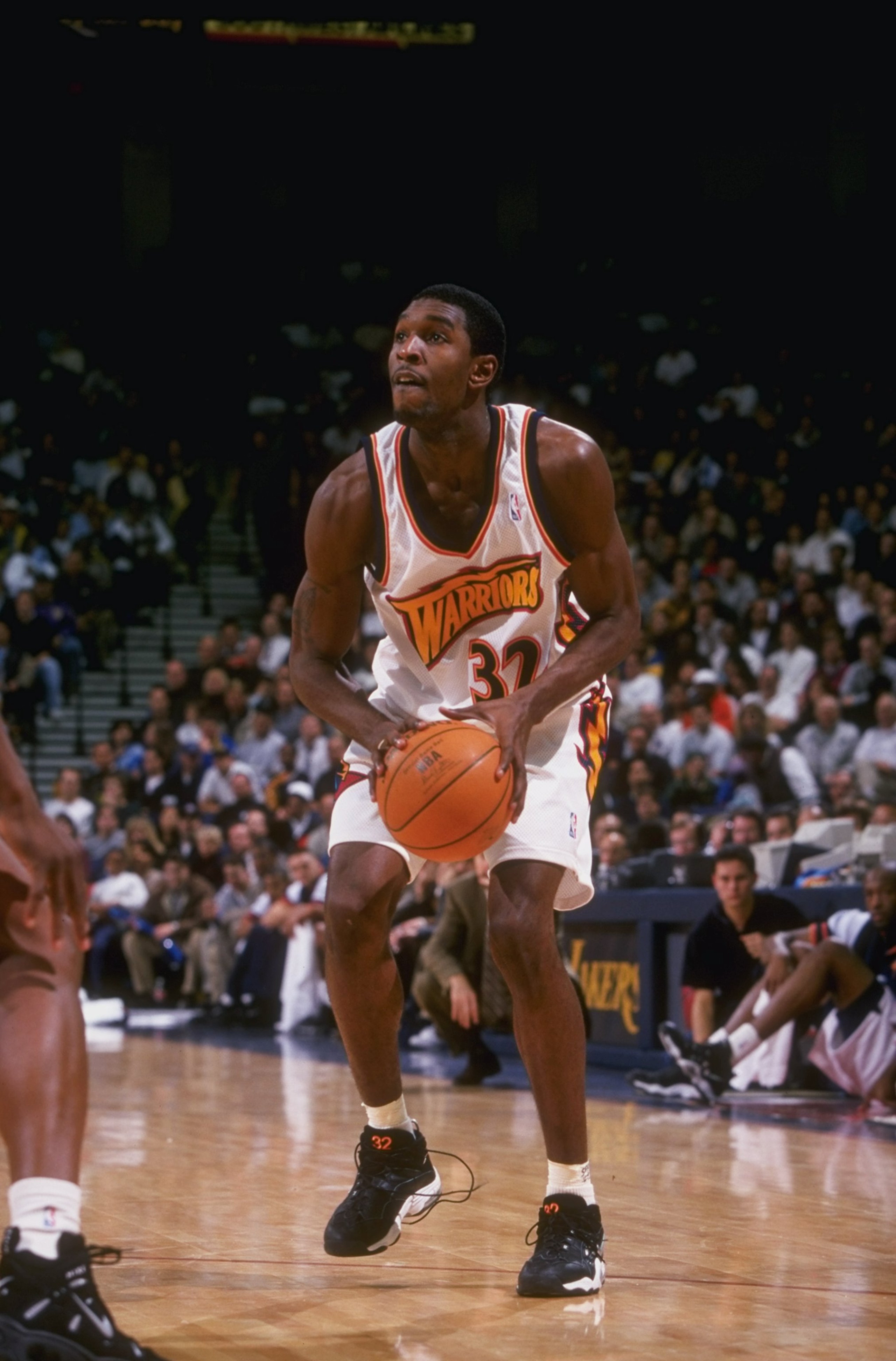 10 Dec 1997:  Forward Joe Smith of the Golden State Warriors moves the ball during a game against the Los Angeles Lakers at the Oakland Coliseum in Oakland, California.  The Warriors won the game, 93-92. Mandatory Credit: Todd Warshaw  /Allsport