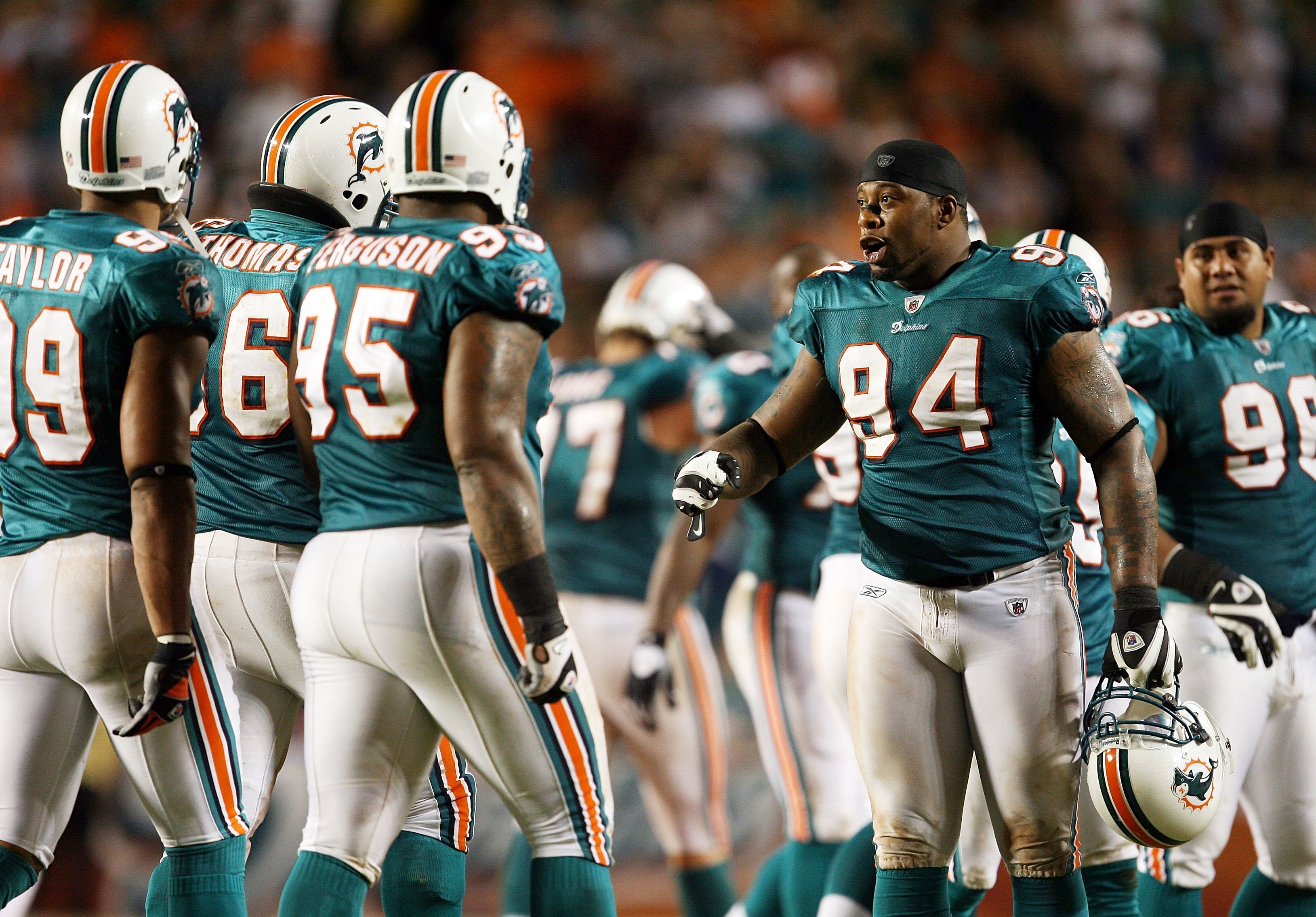 MIAMI - SEPTEMBER 21:  Defensive end Randy Starks #94 of the Miami Dolphins celebrates with teammates after a PAT after a touchdown against the Indianapolis Colts at Land Shark Stadium on September 21, 2009 in Miami, Florida. The Colts defeated the Dolphi