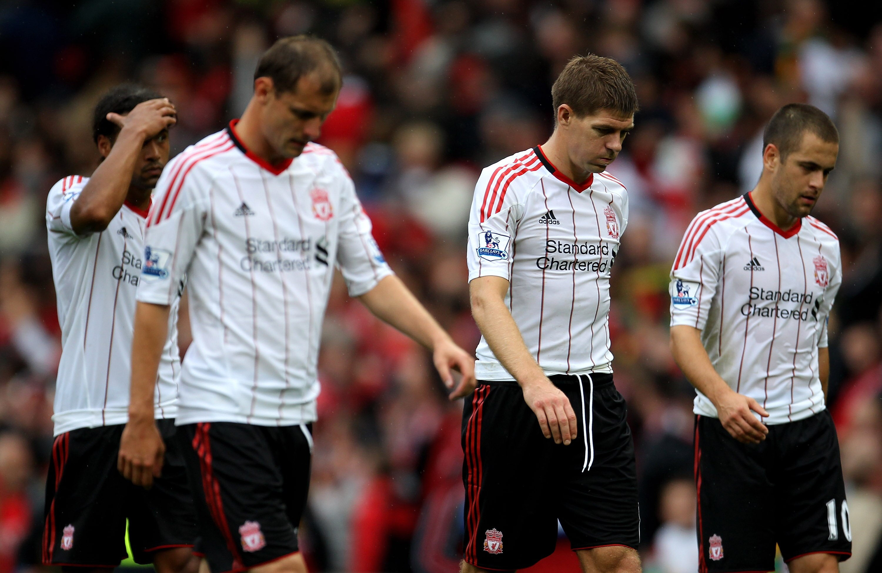 MANCHESTER, ENGLAND - SEPTEMBER 19:  Steven Gerrard of Liverpool leaves the pitch with his team mates at the end of the Barclays Premier League match between Manchester United and Liverpool at Old Trafford on September 19, 2010 in Manchester, England. (Ph
