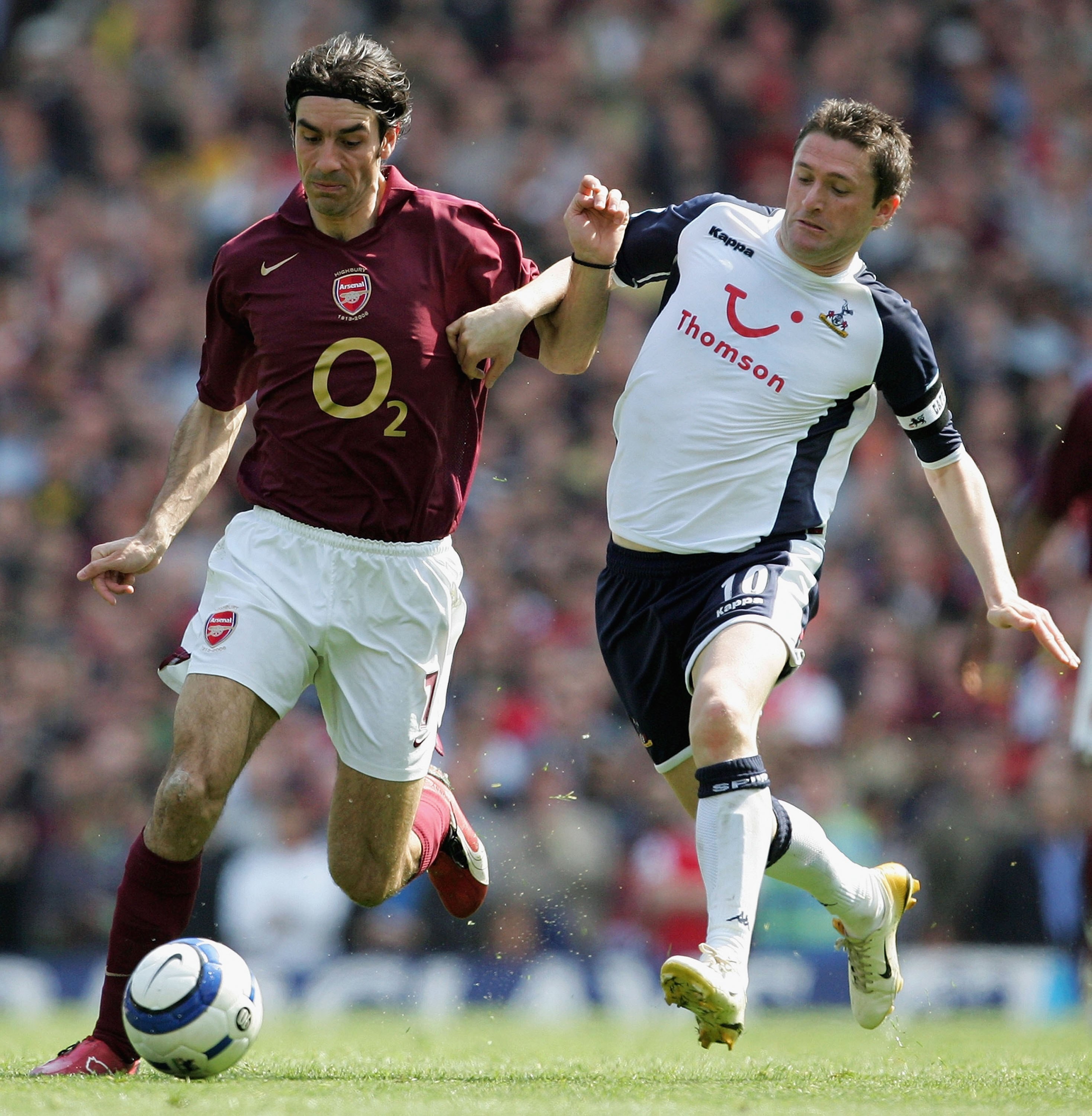 LONDON - APRIL 22:  Robert Pires (L) of Arsenal battles for the ball with (R) Robbie Keane of Spurs during the Barclays Premiership match between Arsenal and Tottenham Hotspur at Highbury on April 22, 2006 in London, England.  (Photo by Mike Hewitt/Getty