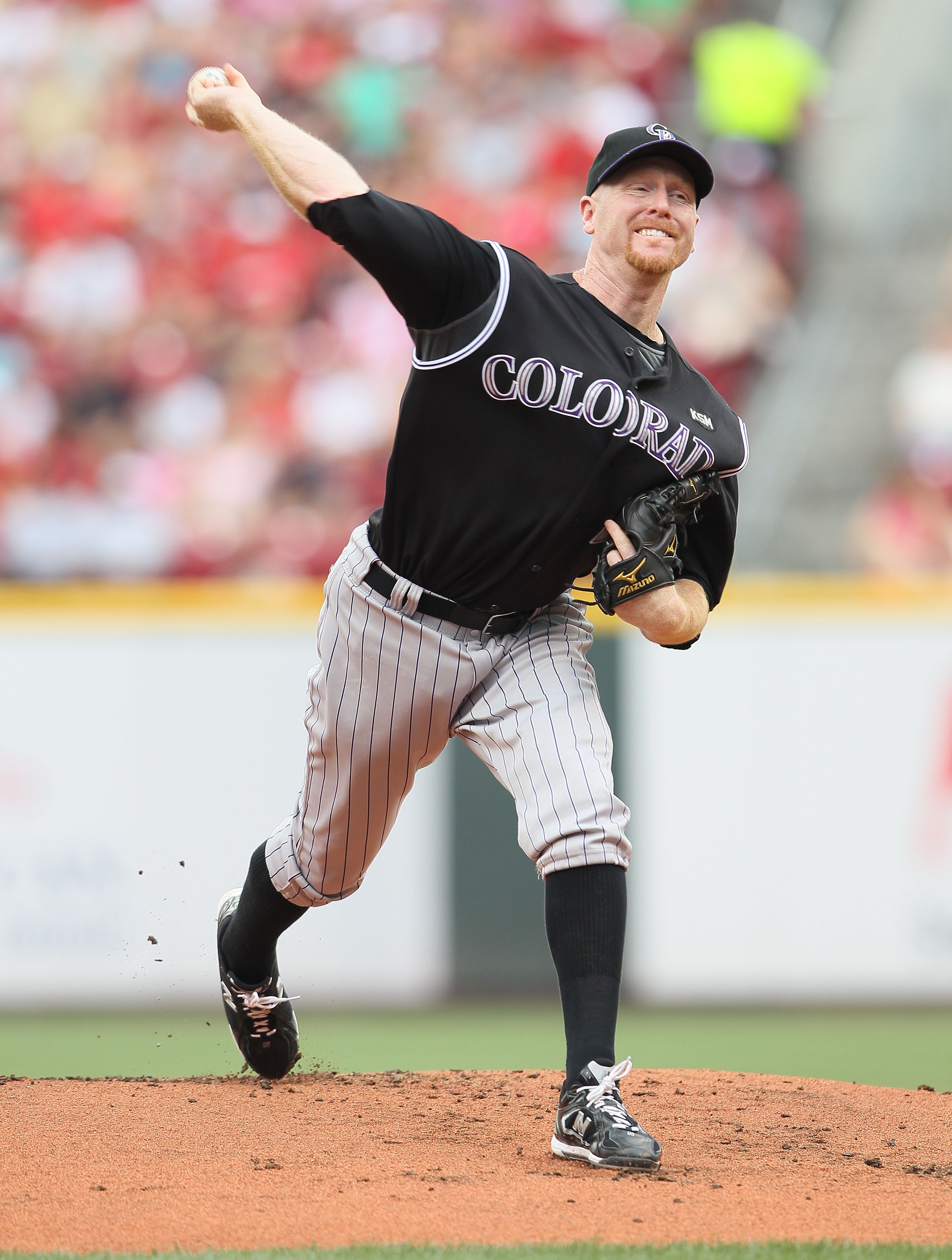 CINCINNATI - JULY 18:  Aaron Cook #28 of the Colorado Rockies throws a pitch during the game against the Cincinnati Reds at Great American Ball Park on July 18, 2010 in Cincinnati, Ohio.  (Photo by Andy Lyons/Getty Images)