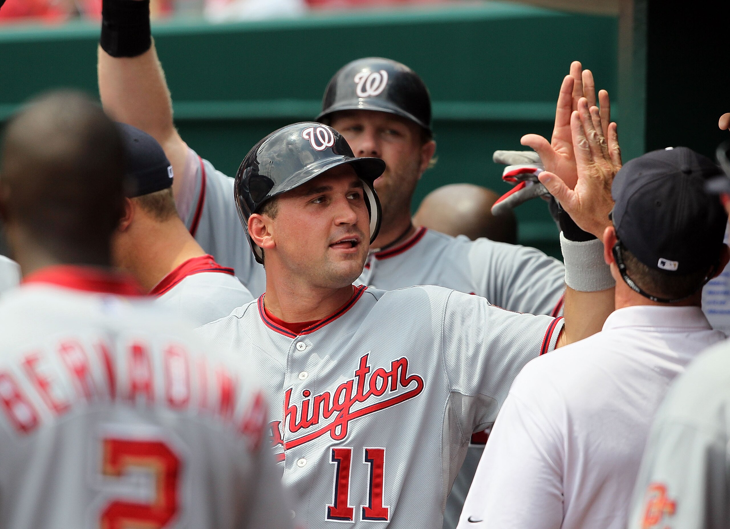 CINCINNATI - JULY 22: Ryan Zimmerman #11 of the Washington Nationals is congratulated by teammates after scoring on a Adam Dunn #44 home run during the game against the Cincinnati Reds at Great American Ball Park on July 22, 2010 in Cincinnati, Ohio. ( CINCINNATI - JULY 22: Ryan Zimmerman #11 of the Washington Nationals is congratulated by teammates after scoring on a Adam Dunn #44 home run during the game against the Cincinnati Reds at Great American Ball Park on July 22, 2010 in Cincinnati, Ohio. (
