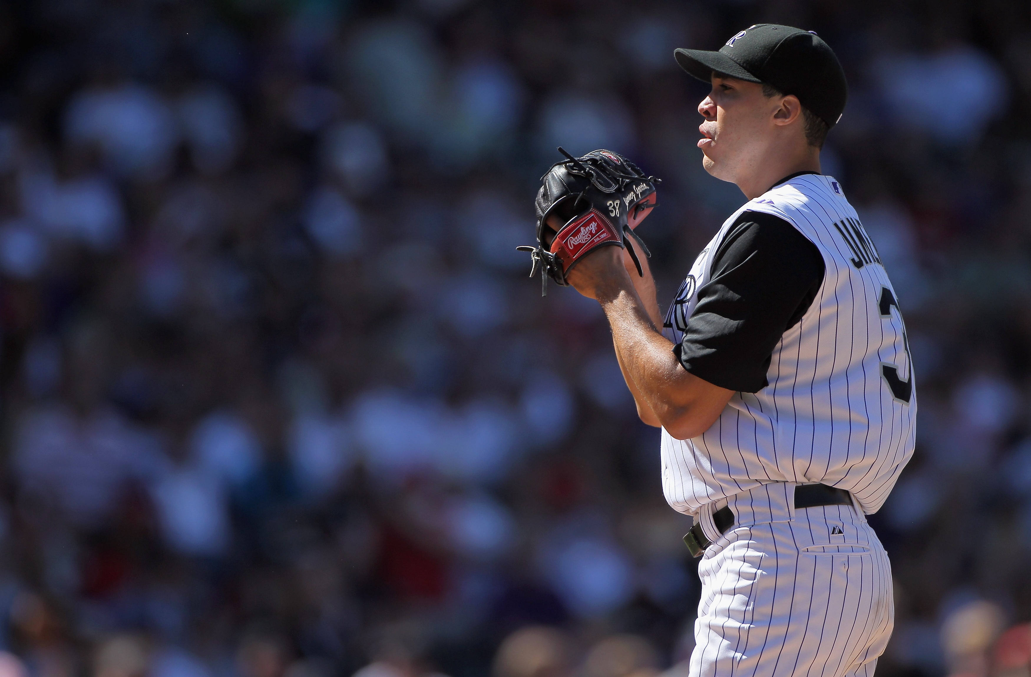DENVER - SEPTEMBER 06:  Starting pitcher Ubaldo Jimenez #38 of the Colorado Rockies works against the Cincinnati Reds at Coors Field on September 6, 2010 in Denver, Colorado. The Rockies defeated the Reds 10-5 as Jimenez earned a club record 18th victory