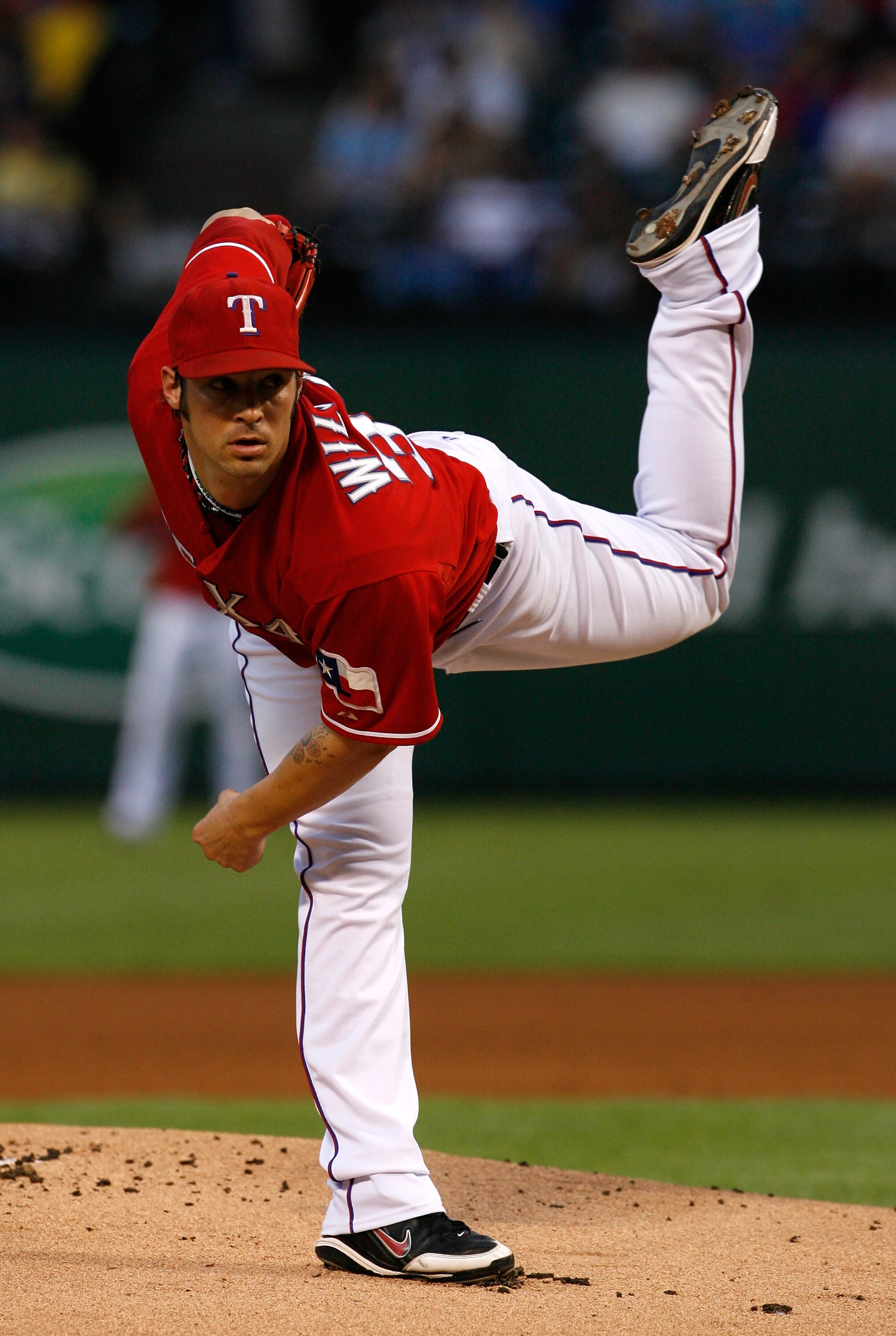 ARLINGTON, TX - SEPTEMBER 10:  Starting pitcher C.J. Wilson #36 pitches against the New York Yankees on September 10, 2010 at Rangers Ballpark in Arlington, Texas.  (Photo by Tom Pennington/Getty Images)