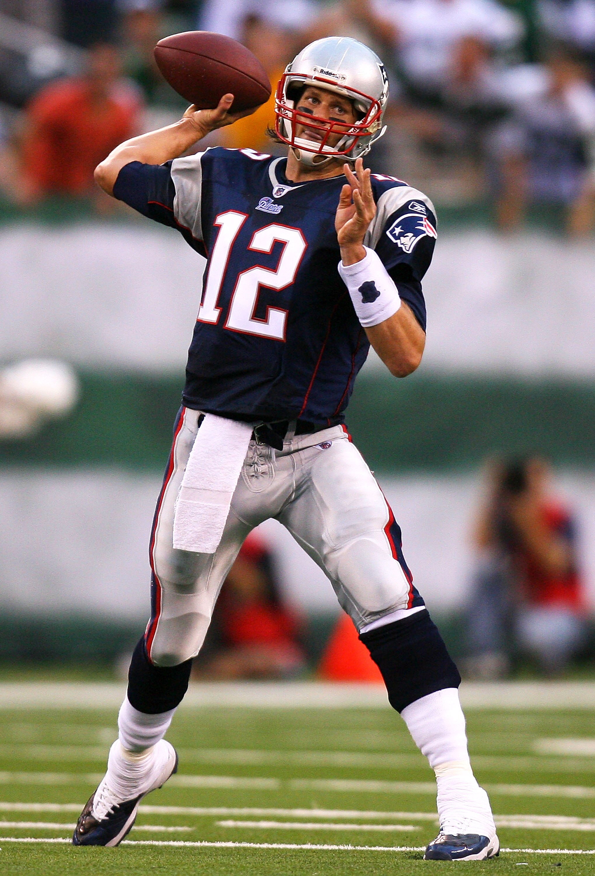 EAST RUTHERFORD, NJ - SEPTEMBER 19: Tom Brady #12 of the New England Patriots drops passes against the New York Jets at the New Meadowlands Stadium on September 19, 2010 in East Rutherford, New Jersey. The Jets defeated the Patriots 28 - 14. (Photo by A EAST RUTHERFORD, NJ - SEPTEMBER 19: Tom Brady #12 of the New England Patriots drops passes against the New York Jets at the New Meadowlands Stadium on September 19, 2010 in East Rutherford, New Jersey. The Jets defeated the Patriots 28 - 14. (Photo by A