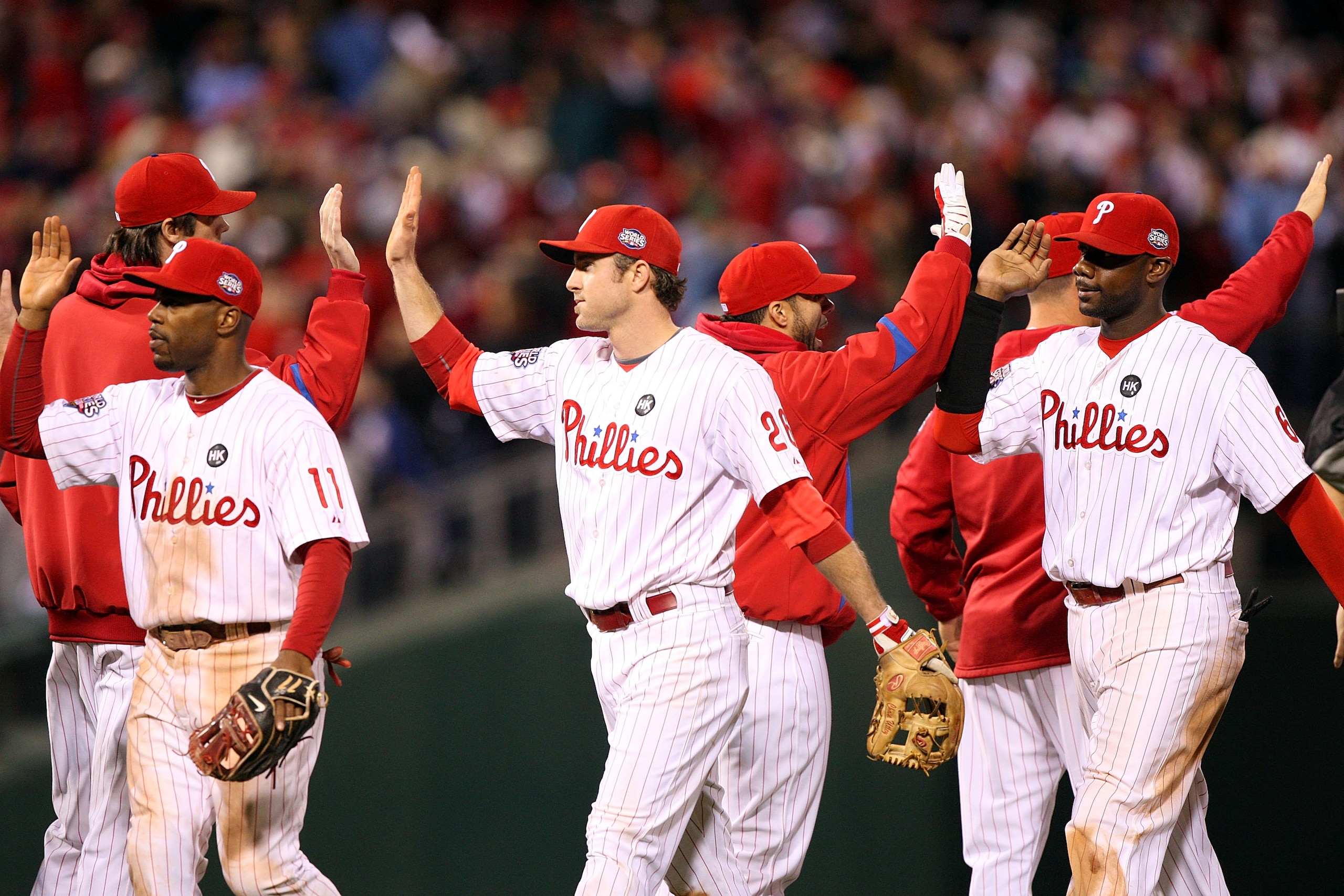PHILADELPHIA - NOVEMBER 02: (Front row L-R) Jimmy Rollins #11, Chase Utley #26 and Ryan Howard #6 of the Philadelphia Phillies celebrate with their teammates after their 8-6 win against the New York Yankees in Game Five of the 2009 MLB World Series at Ci PHILADELPHIA - NOVEMBER 02: (Front row L-R) Jimmy Rollins #11, Chase Utley #26 and Ryan Howard #6 of the Philadelphia Phillies celebrate with their teammates after their 8-6 win against the New York Yankees in Game Five of the 2009 MLB World Series at Ci