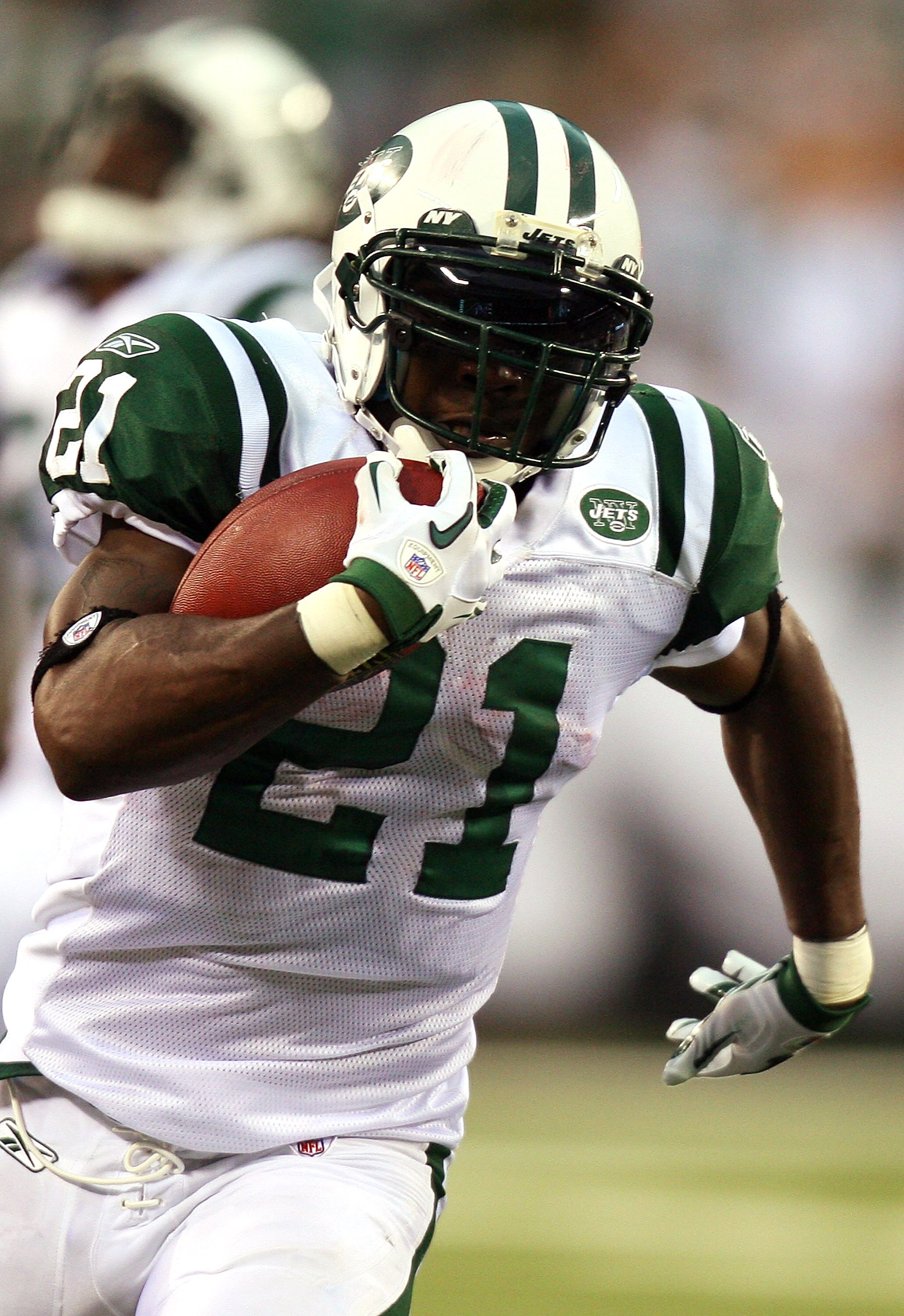 EAST RUTHERFORD, NJ - SEPTEMBER 19:  LaDainian Tomlinson #21 of the New York Jets runs the ball against the New England Patriots at the New Meadowlands Stadium on September 19, 2010 in East Rutherford, New Jersey. The Jets defeated the Patriots 28 - 14.  