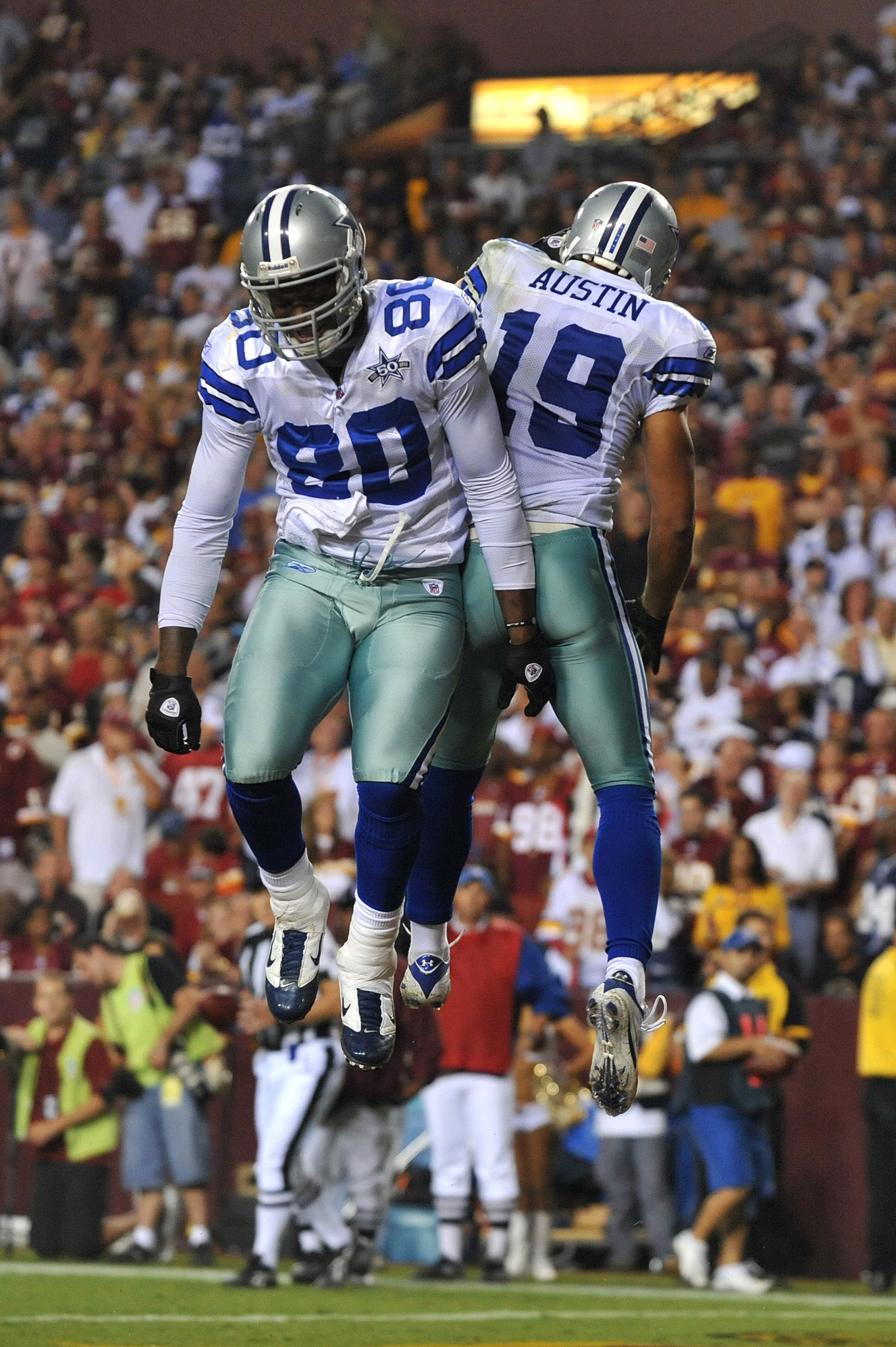LANDOVER - SEPTEMBER 12:  Miles Austin #19 of the Dallas Cowboys celebrates his touchdown during the NFL season opener against the Washington Redskins at FedExField on September 12, 2010 in Landover, Maryland. The Redskins defeated the Cowboys 13-7. (Phot