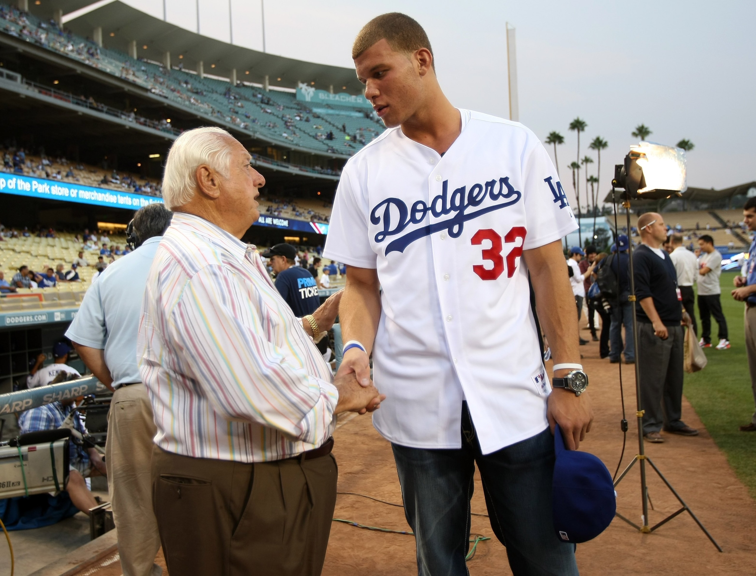 LOS ANGELES, CA - SEPTEMBER 02:  First overall pick in the NBA draft Blake Griffin of the Los Angeles Clippers is greeted by Dodger executive Tomy Lasorda before throwing out a ceremonial first pitch before the game between the Los Angeles Dodgers the Ari