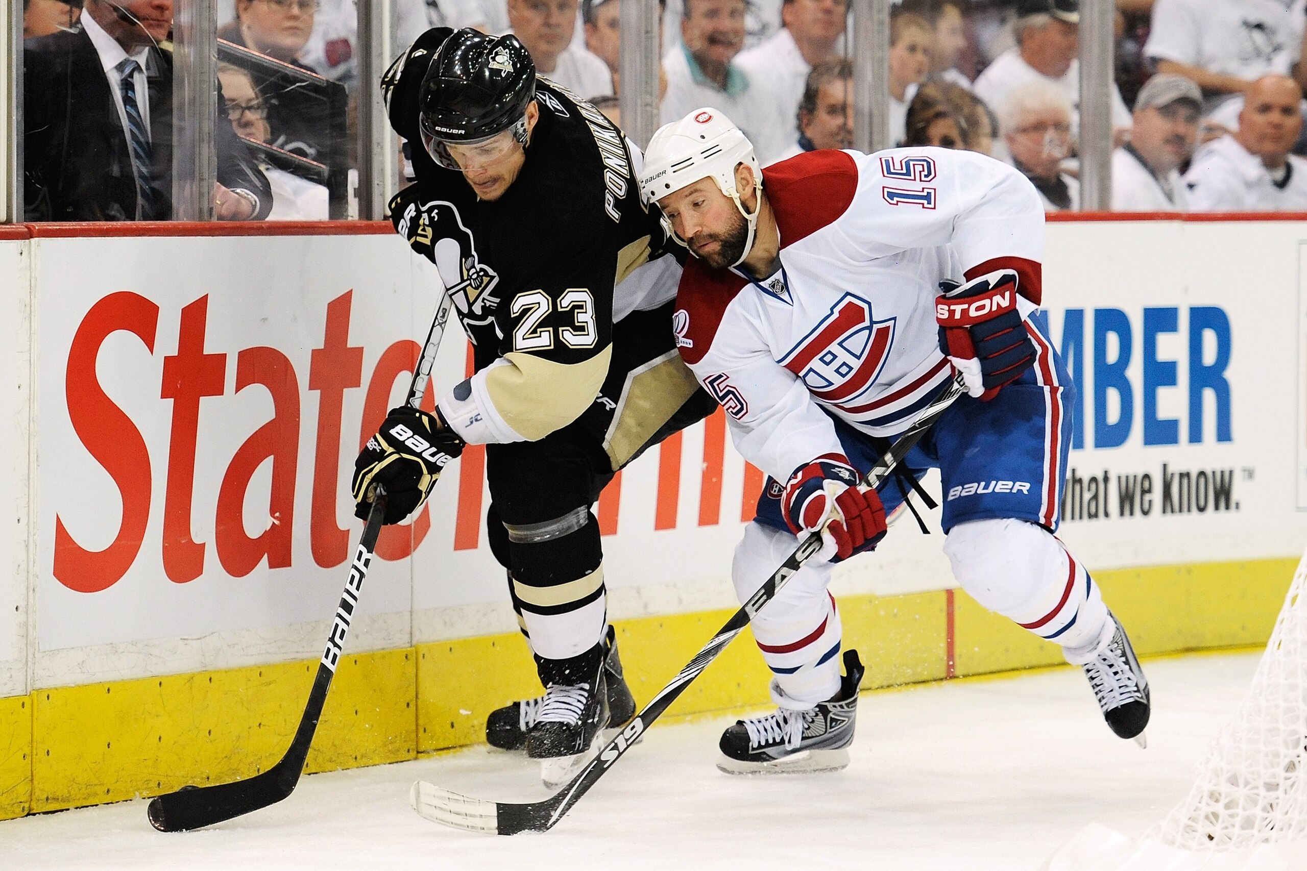 PITTSBURGH - APRIL 30:  Alexei Ponikarovsky #23 of the Pittsburgh Penguins controls the puck as Glen Metropolit #15 of the Montreal Canadiens defends in Game One of the Eastern Conference Semifinals during the 2010 NHL Stanley Cup Playoffs on April 30, 20
