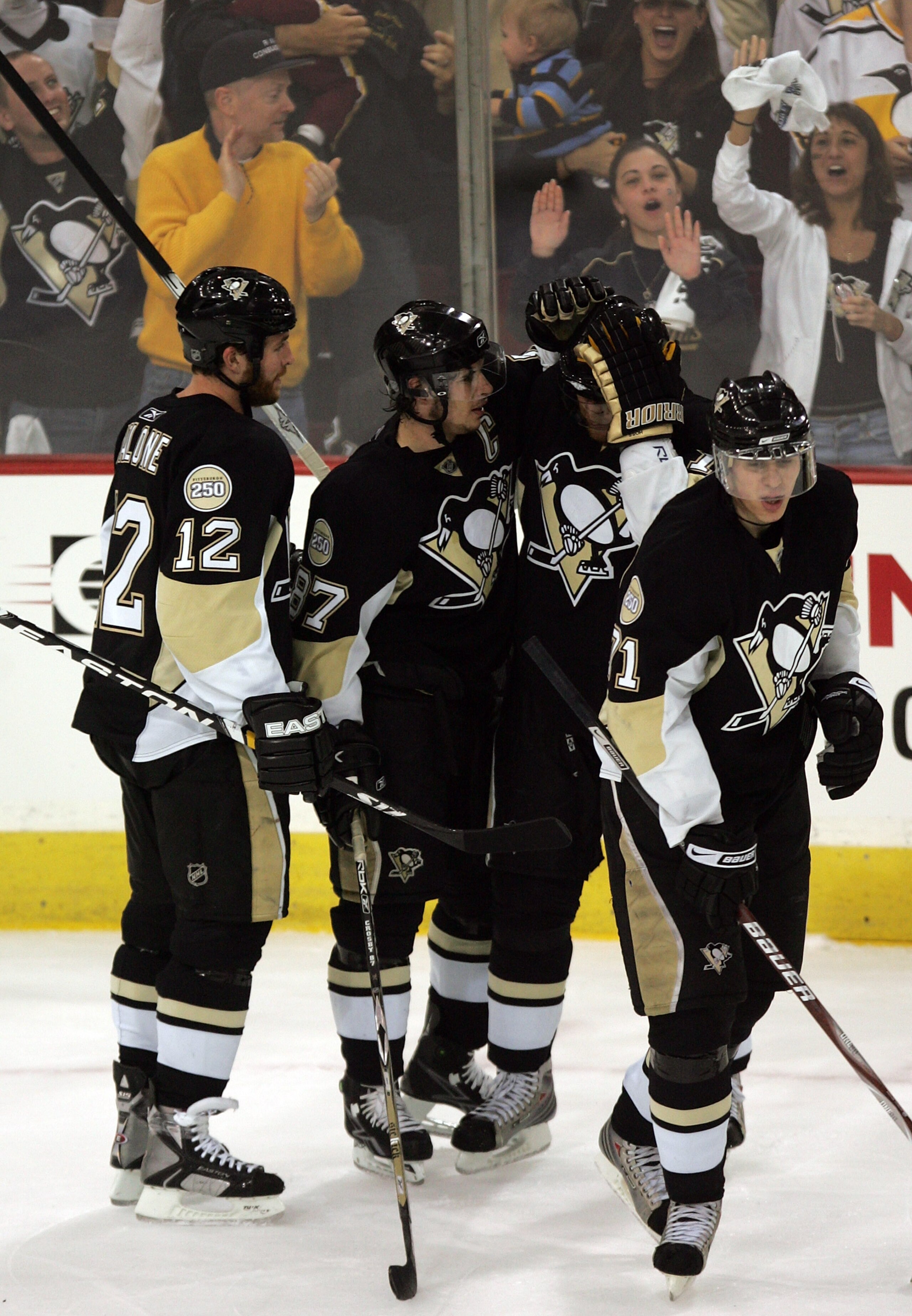 PITTSBURGH - MAY 11:  Marian Hossa #18 of the Pittsburgh Penguins is cogratulated by teammates Sidney Crosby #87 and Ryan Malone #12 after scoring a goal at 13:43 in the second period against the Philadelphia Flyers during game two of the Eastern Conferen