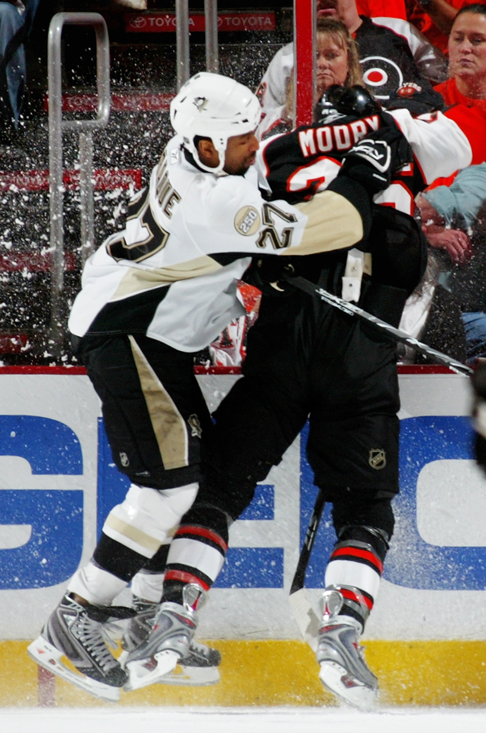 PHILADELPHIA - MAY 13: Georges Laraque #27 of the Pittsburgh Penguins checks Jaroslav Modry #26 of the Philadelphia Flyers during game three of the Eastern Conference Finals of the 2008 NHL Stanley Cup Playoffs at Wachovia Center on May 13, 2008 in Phila PHILADELPHIA - MAY 13: Georges Laraque #27 of the Pittsburgh Penguins checks Jaroslav Modry #26 of the Philadelphia Flyers during game three of the Eastern Conference Finals of the 2008 NHL Stanley Cup Playoffs at Wachovia Center on May 13, 2008 in Phila
