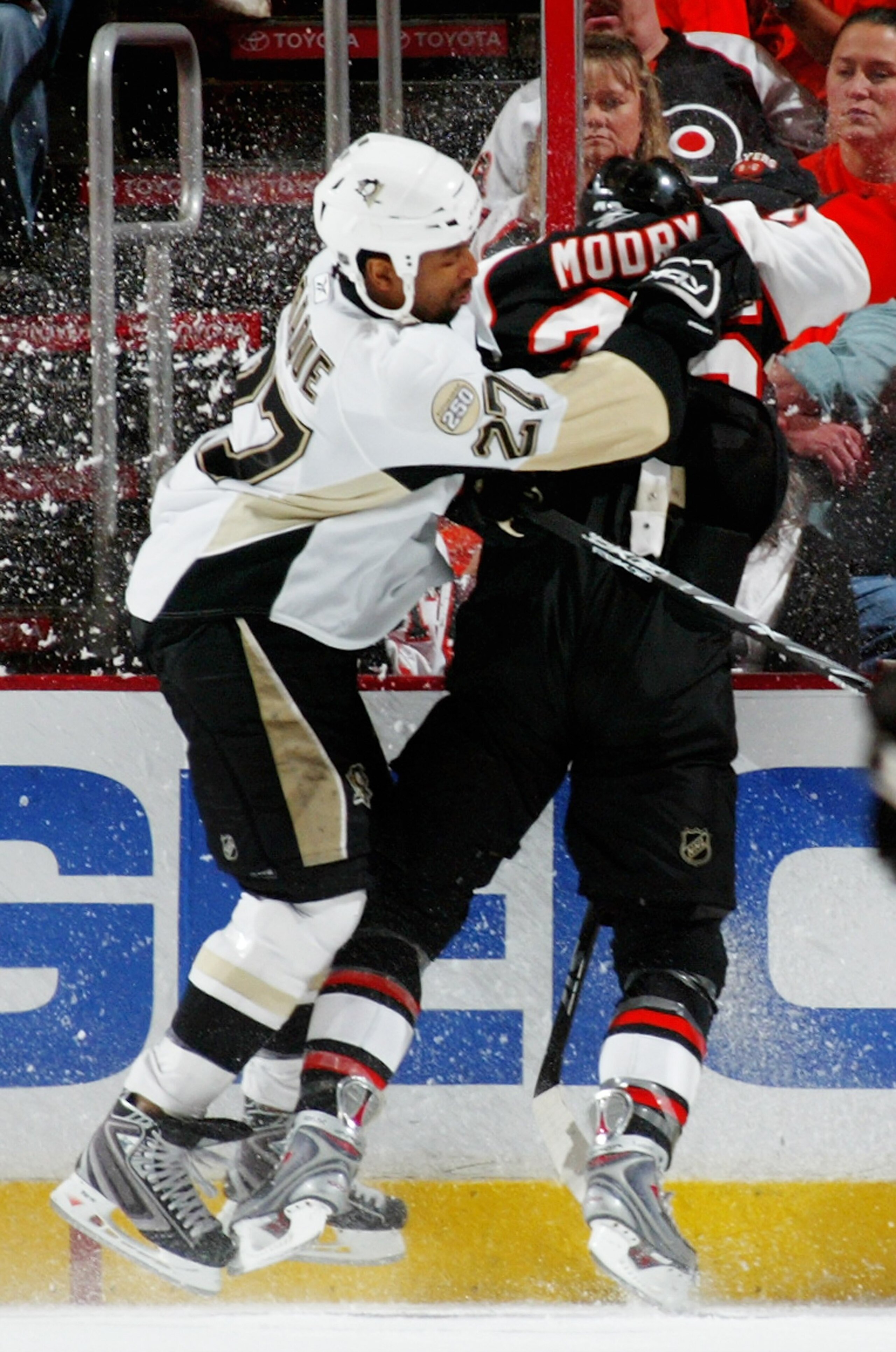 PHILADELPHIA - MAY 13:  Georges Laraque #27 of the Pittsburgh Penguins checks Jaroslav Modry #26 of the Philadelphia Flyers during game three of the Eastern Conference Finals of the 2008 NHL Stanley Cup Playoffs at Wachovia Center on May 13, 2008 in Phila