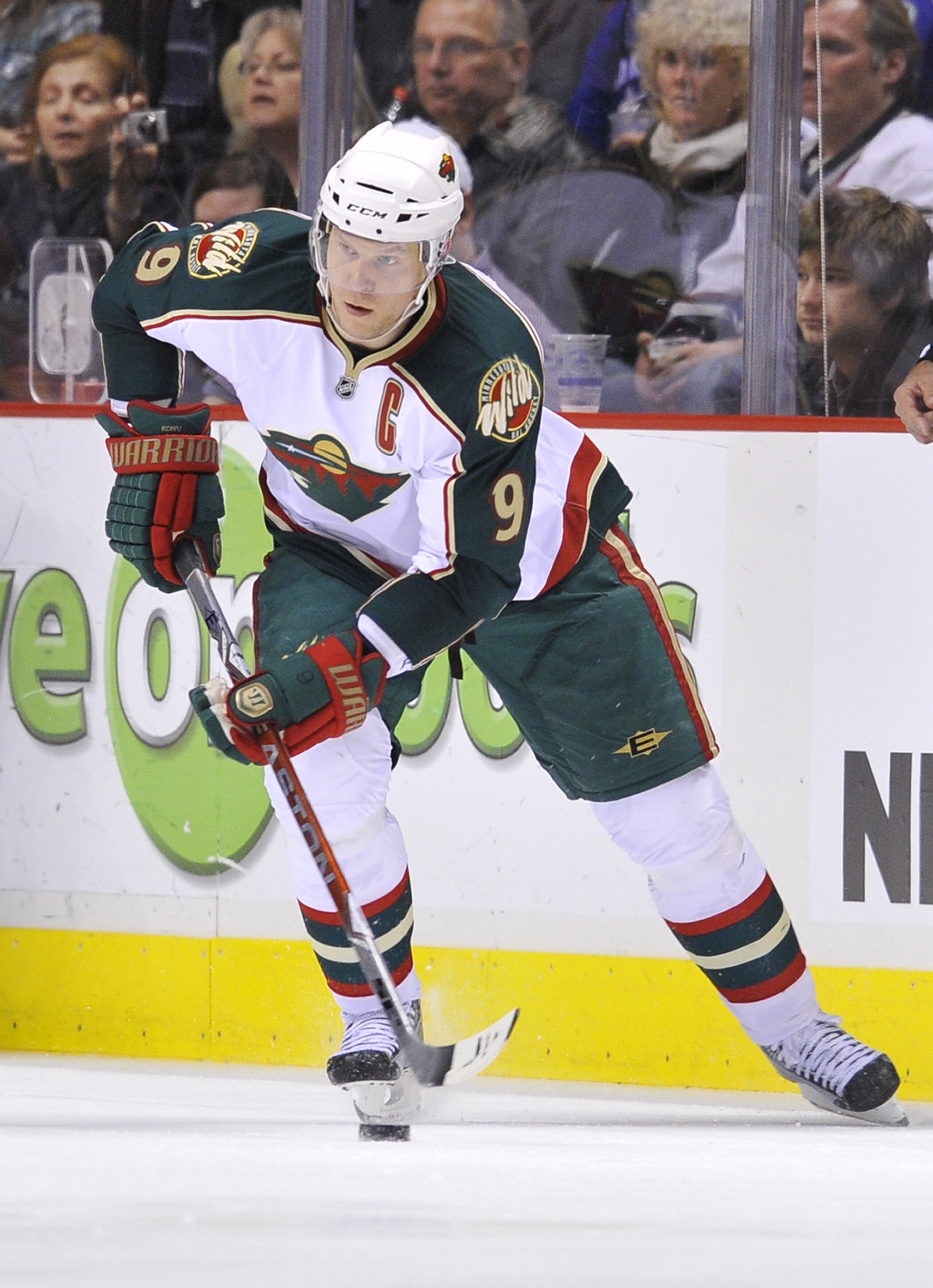 VANCOUVER, CANADA - APRIL 4:  Mikko Koivu #9 of the Minnesota Wild carries the puck up ice during the NHL game against the Vancouver Canucks on April 04, 2010 at General Motors Place in Vancouver, British Columbia, Canada.  (Photo by Rich Lam/Getty Images