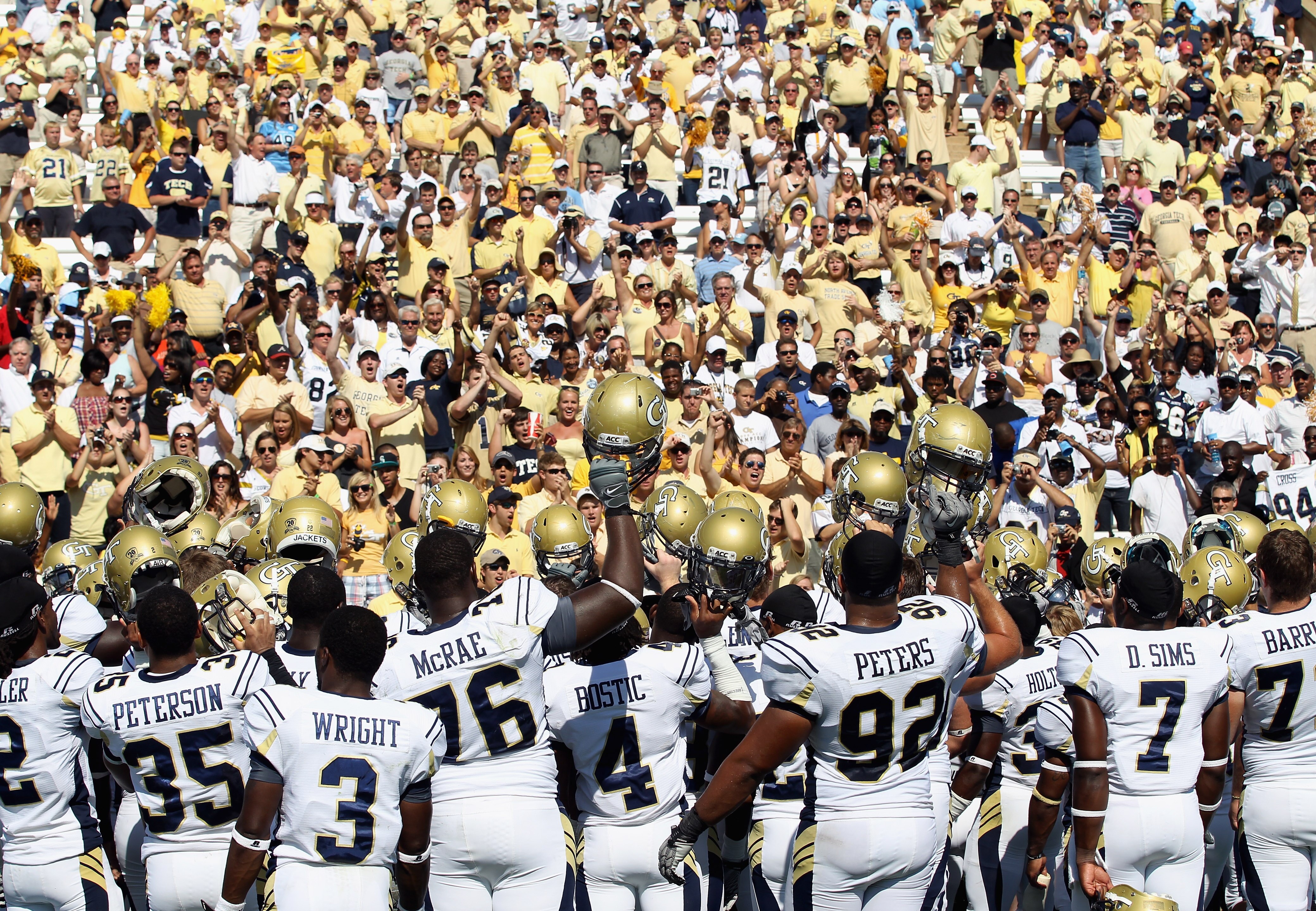 CHAPEL HILL, NC - SEPTEMBER 18:  The Georgia Tech Yellow Jackets celebrate with fans after defeating the North Carolina Tar Heels during their game at Kenan Stadium on September 18, 2010 in Chapel Hill, North Carolina.  (Photo by Streeter Lecka/Getty Imag