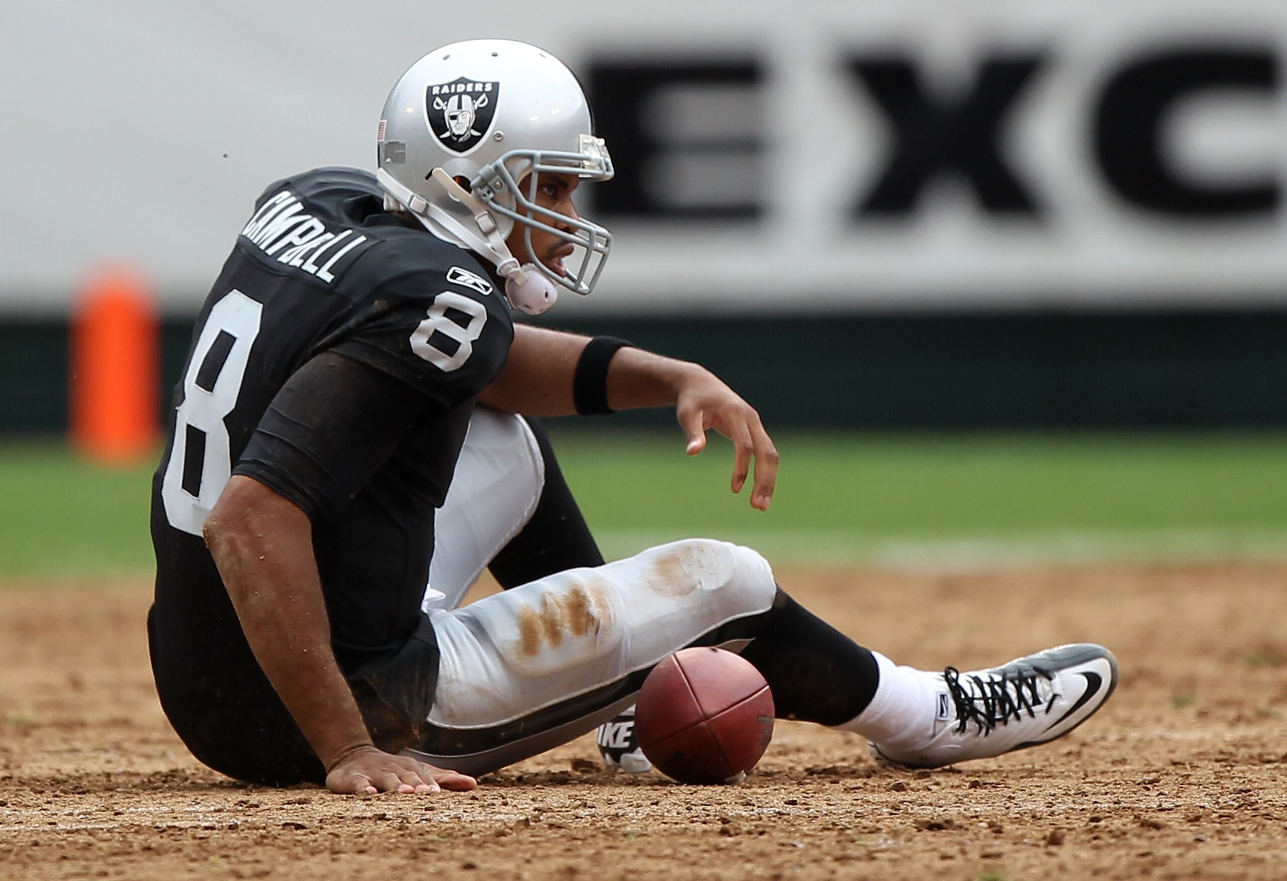 OAKLAND, CA - SEPTEMBER 19:  Jason Campbell #8 of the Oakland Raiders lies on the ground after being sacked against the St. Louis Rams during an NFL game at Oakland-Alameda County Coliseum on September 19, 2010 in Oakland, California.  (Photo by Jed Jacob