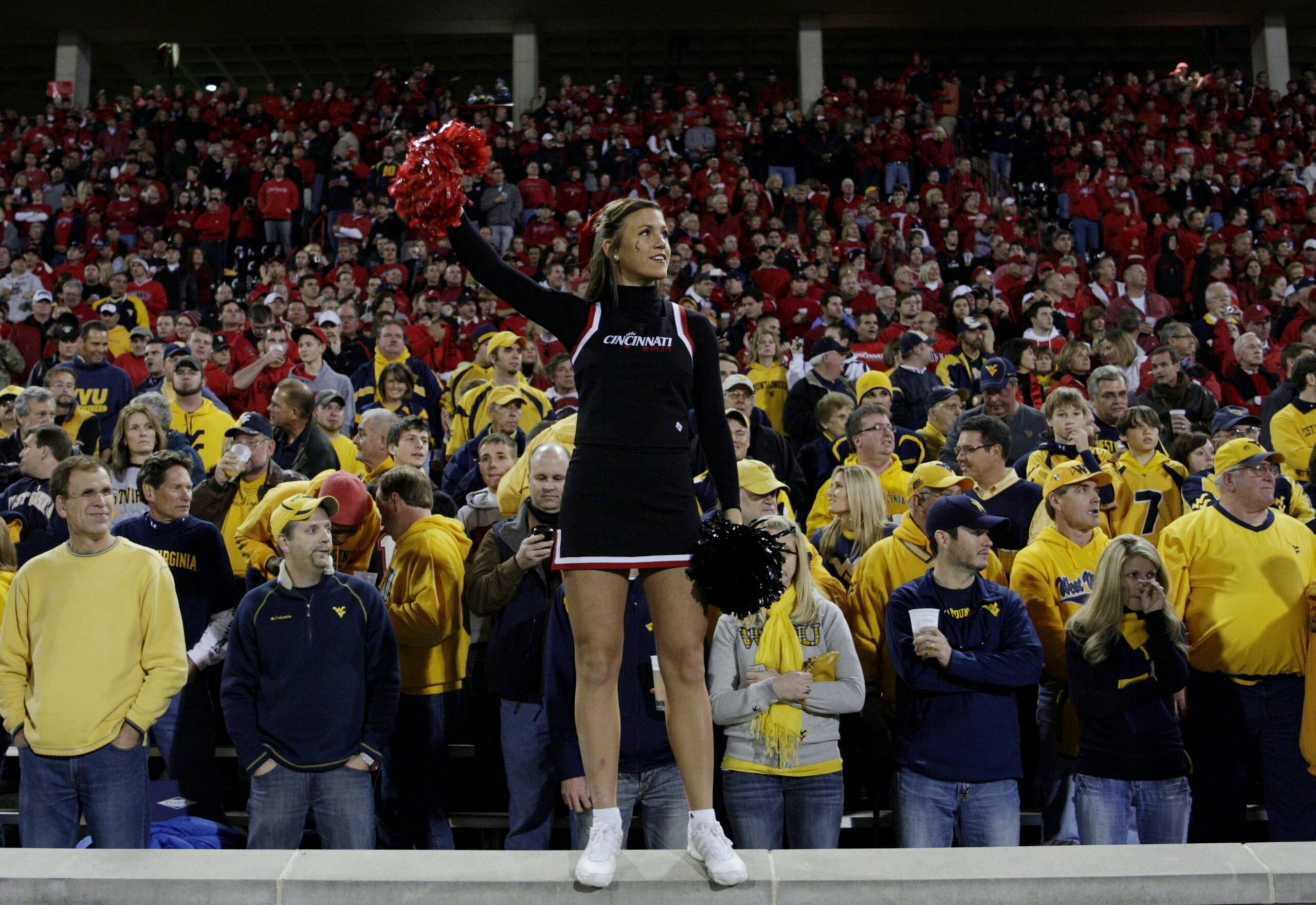 CINCINNATI - NOVEMBER 13:  A Cincinnati Bearcats cheerleader gets ready for the game against the West Virginia Mountaineers at Nippert Stadium on November 13, 2009 in Cincinnati, Ohio.  (Photo by Andy Lyons/Getty Images)