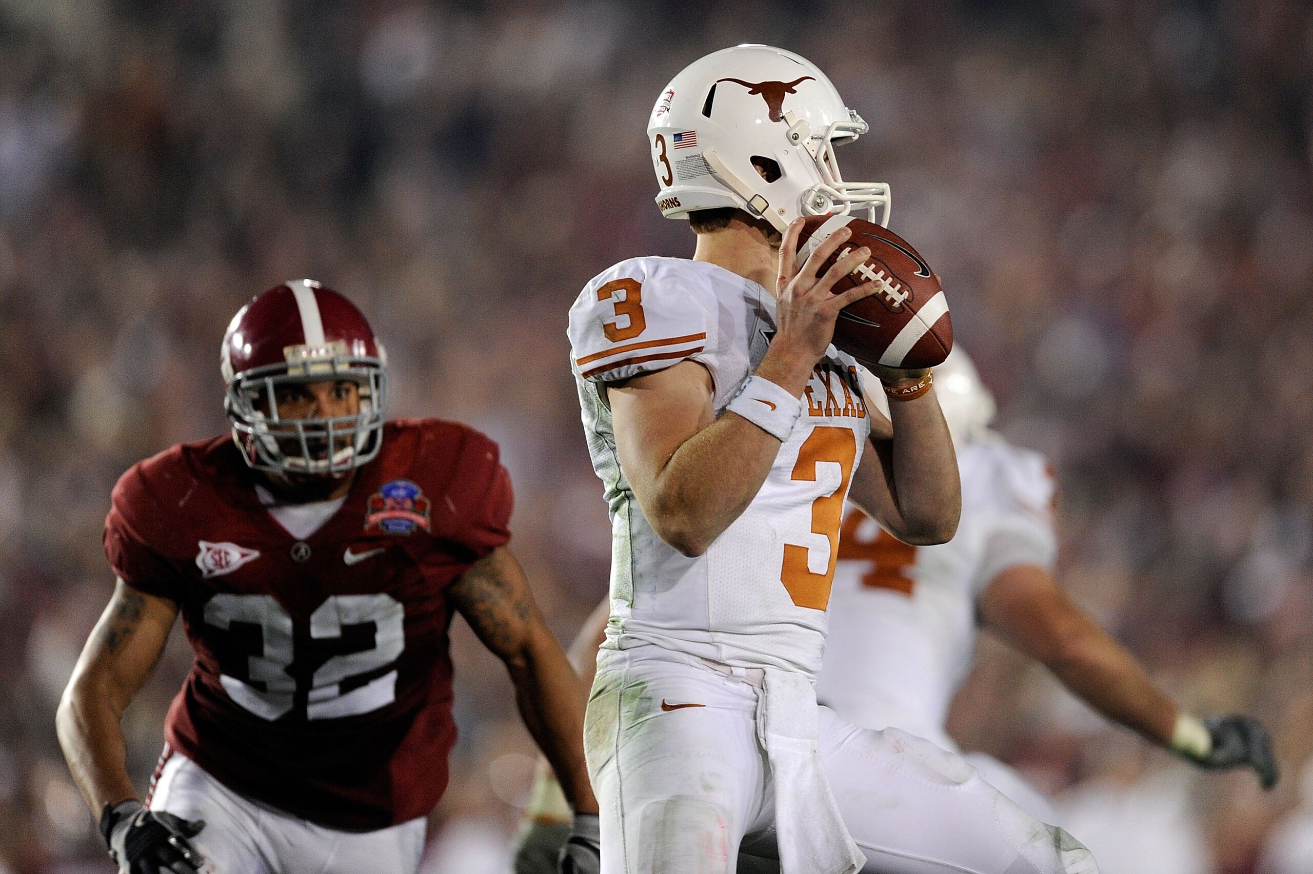 PASADENA, CA - JANUARY 07:  Quarterback Garrett Gilbert #3 of the Texas Longhorns looks to pass as linebacker Eryk Anders #32 of the Alabama Crimson Tide rushes in during the Citi BCS National Championship game at the Rose Bowl on January 7, 2010 in Pasad