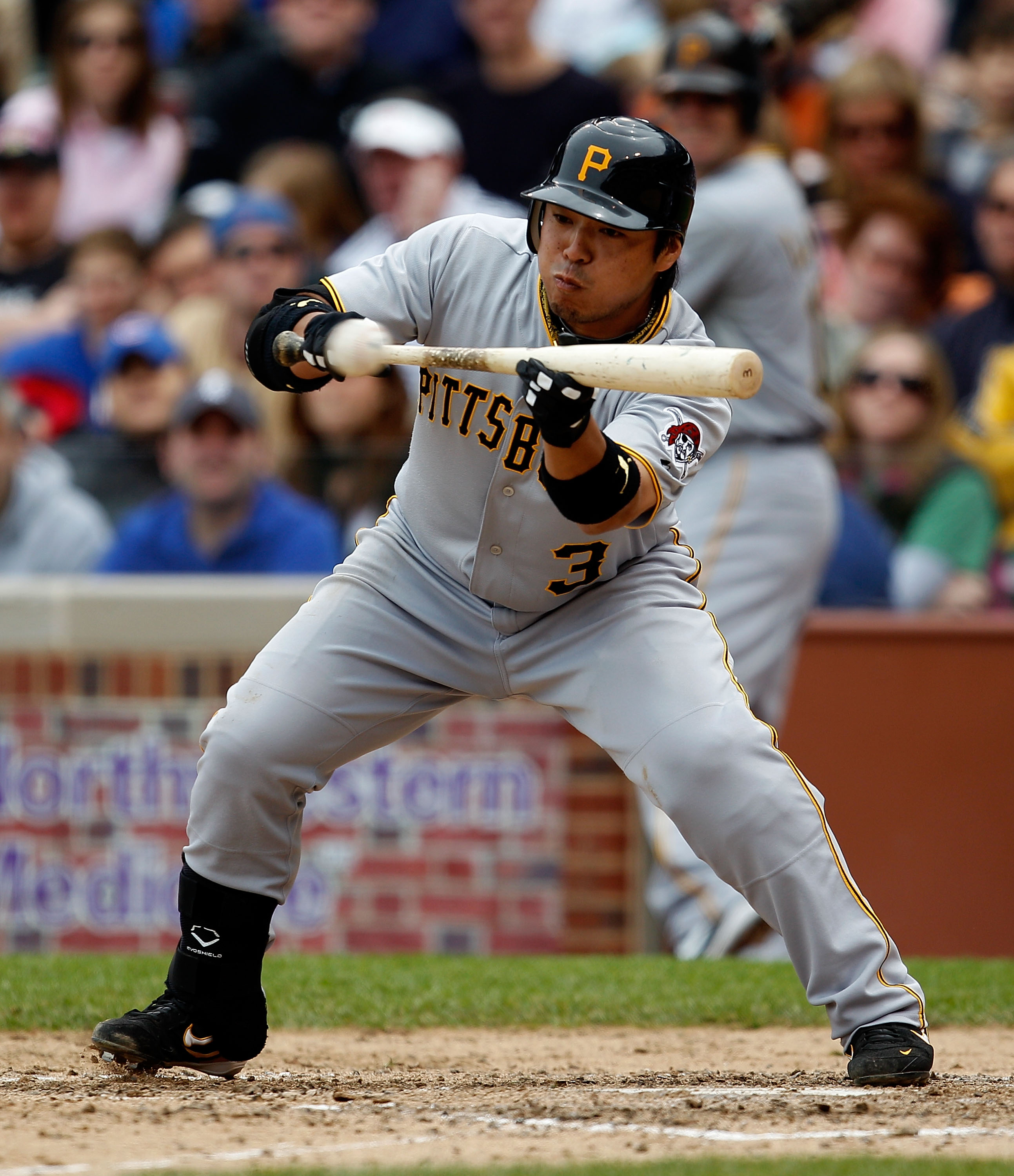 CHICAGO - MAY 15: Aki Iwamura #3 of the Pittsburgh Pirates attempts a bunt against the Chicago Cubs at Wrigley Field on May 15, 2010 in Chicago, Illinois. The Pirates defeated the Cubs 4-3. (Photo by Jonathan Daniel/Getty Images)