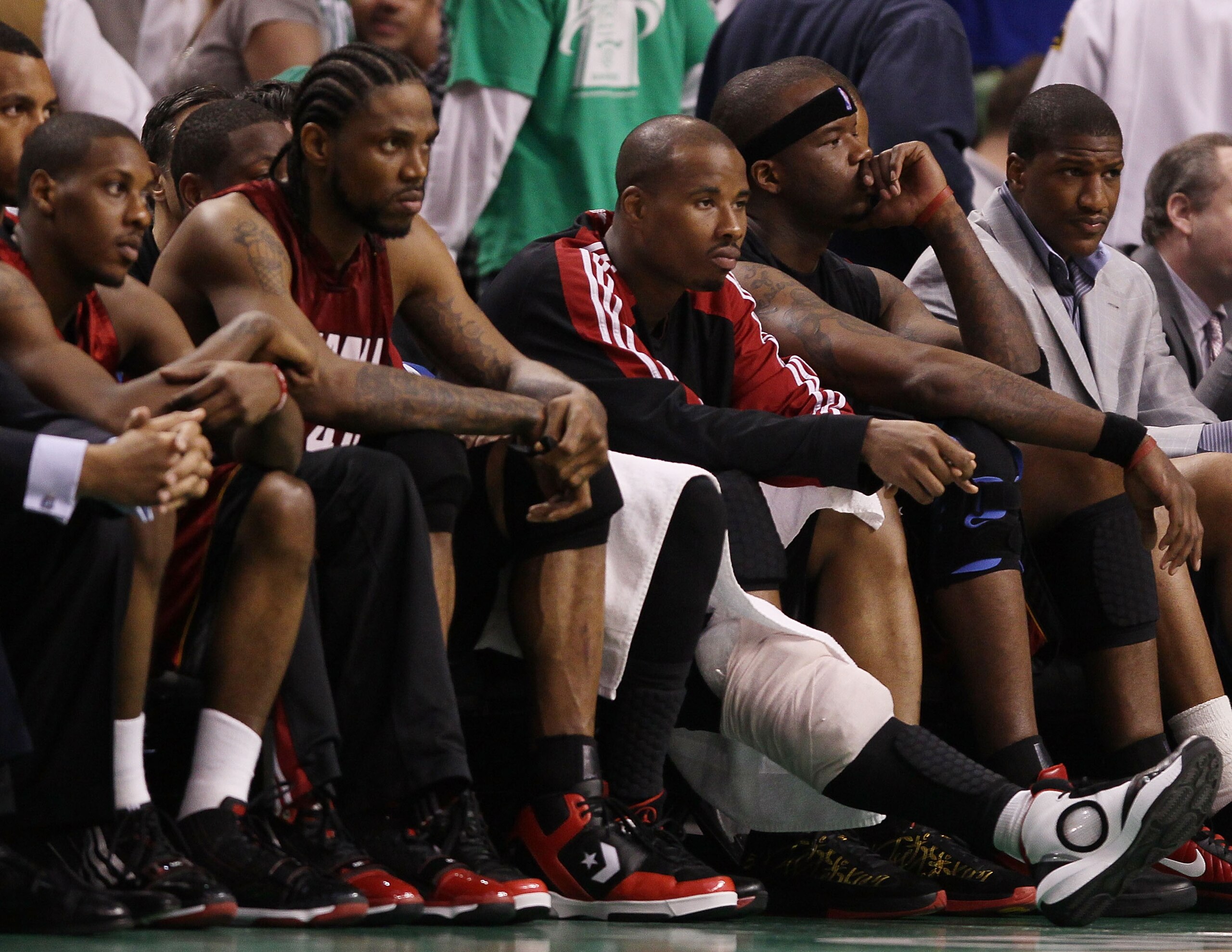 BOSTON - APRIL 20:  Mario Chalmers #6, Udonis Haslem #40,Quentin Richardson #5 and Jermaine O'Neal #7 of the Miami Heat sit on the bench in the fourth quarter against the Boston Celtics during Game Two of the Eastern Conference Quarterfinals of the 2010 N