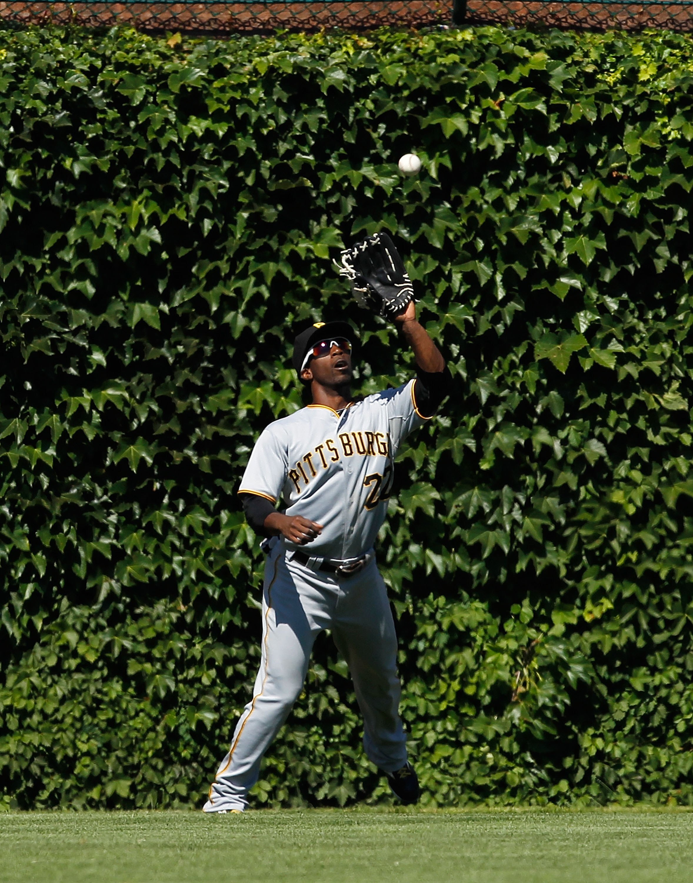 CHICAGO - JUNE 30: Andrew McCutchen #22 of the Pittsburgh Pirates catches a fly ball against the Chicago Cubs at Wrigley Field on June 30, 2010 in Chicago, Illinois. The Pirates defeated the Cubs 2-0. (Photo by Jonathan Daniel/Getty Images)
