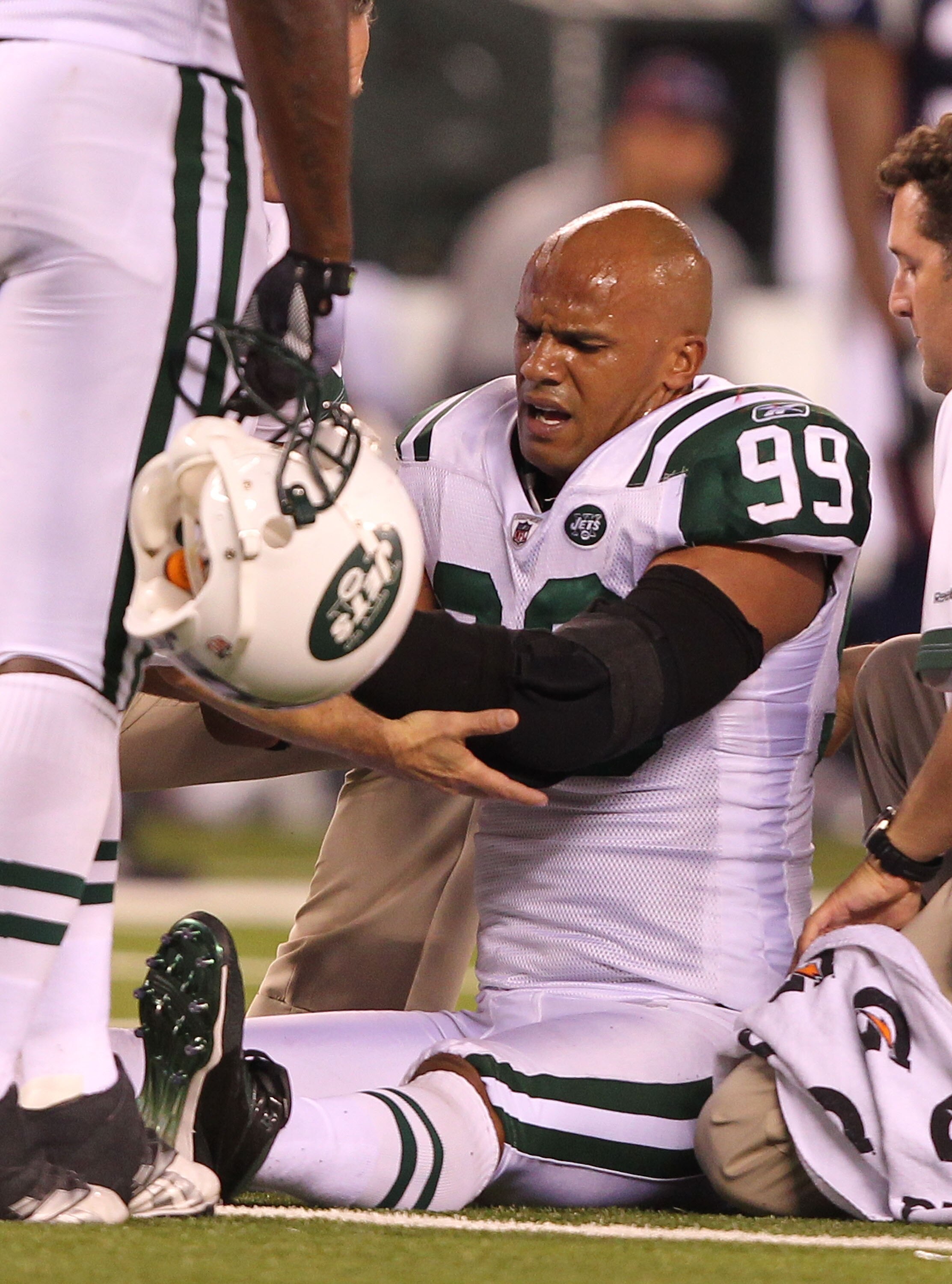 EAST RUTHERFORD, NJ - SEPTEMBER 19:  Jason Taylor #99 of the New York Jets is injured after sacking Tom Brady of the New England Patriots during their  game on September 19, 2010 at the New Meadowlands Stadium  in East Rutherford, New Jersey.  (Photo by A