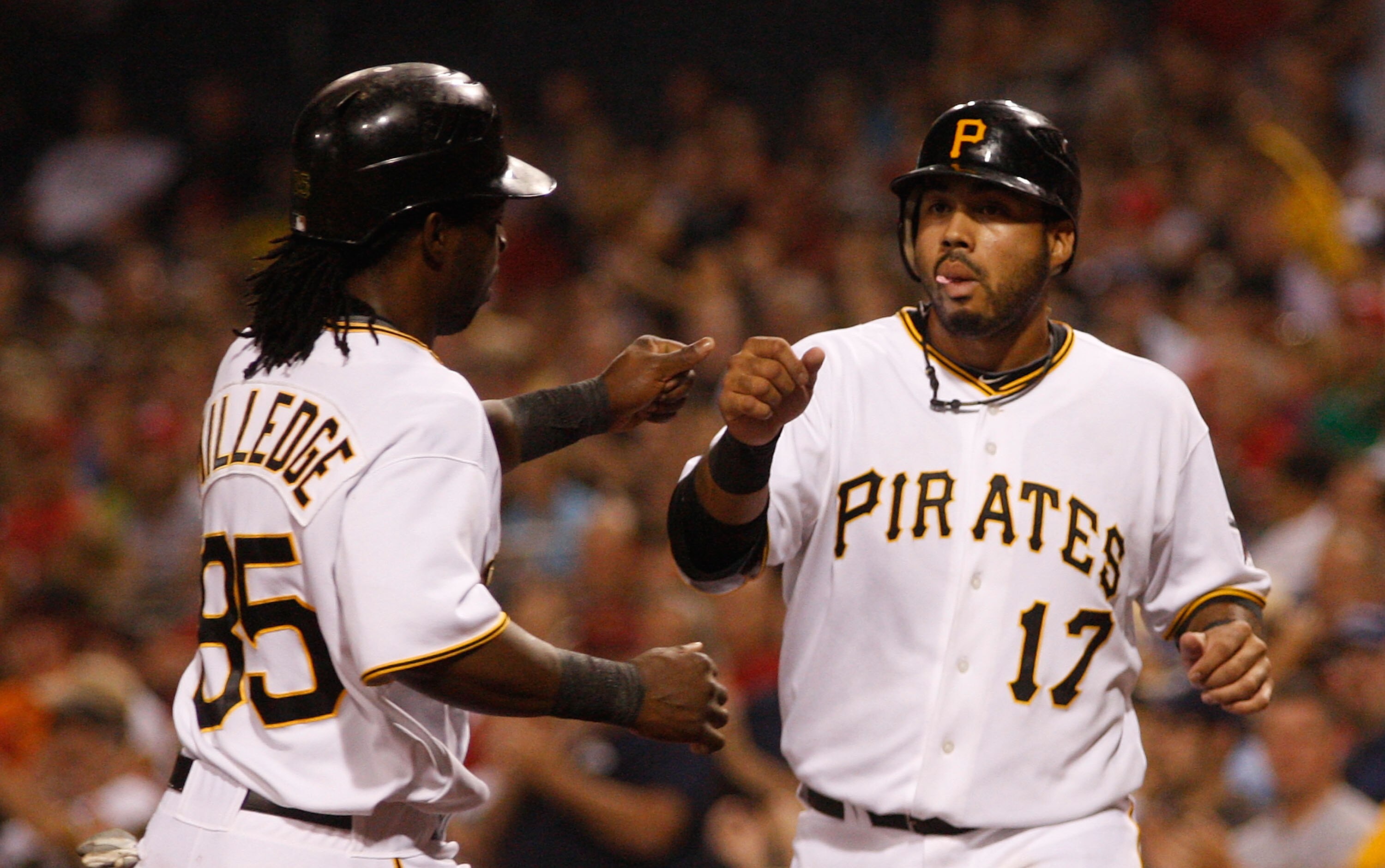 PITTSBURGH - AUGUST 03:  Pedro Alvarez #17 of the Pittsburgh Pirates congratulates teammate Lastings Milledge #85 after they scored in the second inning against the Cincinnati Reds during the game on August 3, 2010 at PNC Park in Pittsburgh, Pennsylvania.